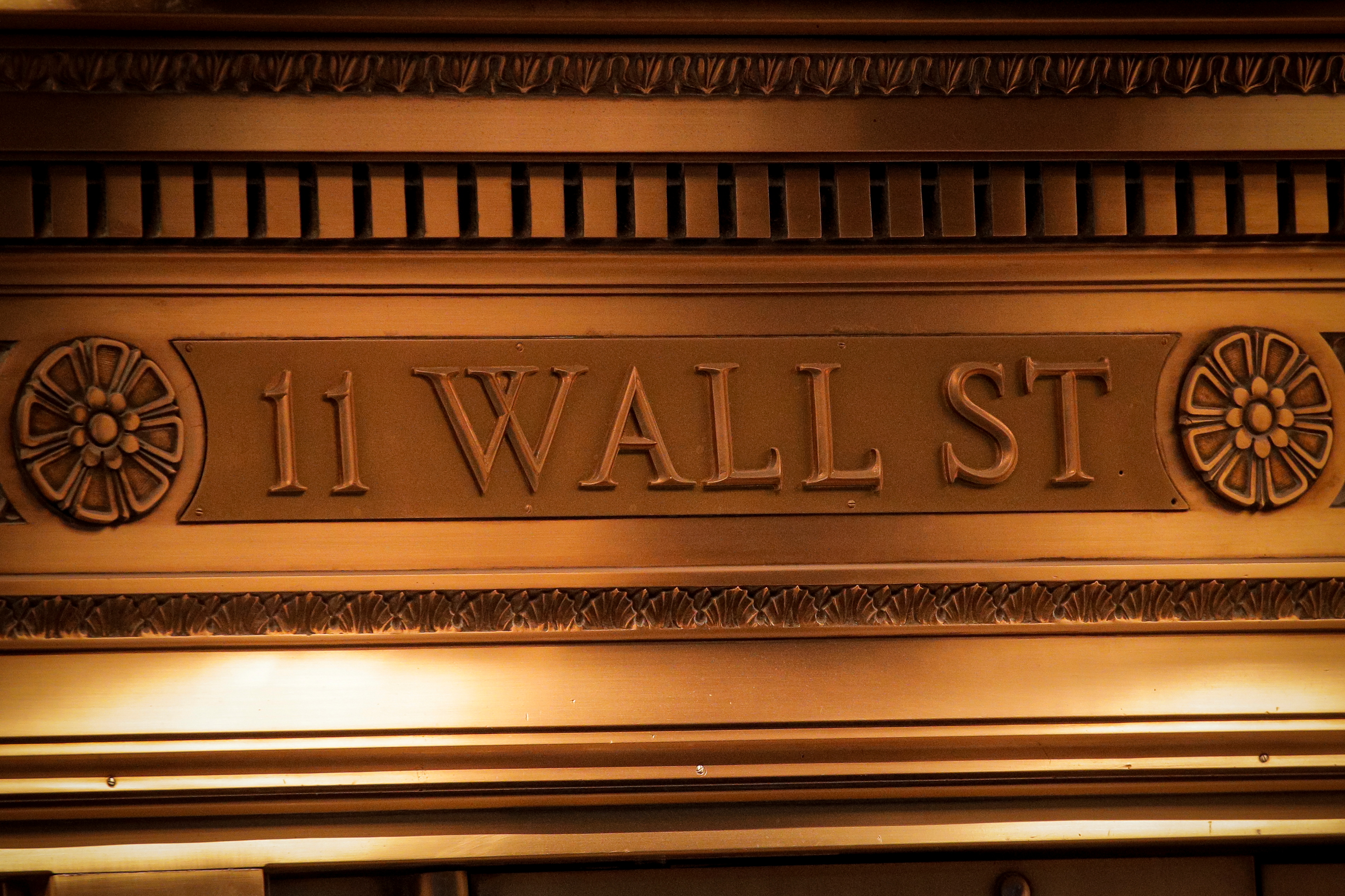 A sign is seen outside the 11 Wall St. entrance of the New York Stock Exchange in New York, March 1, 2021.