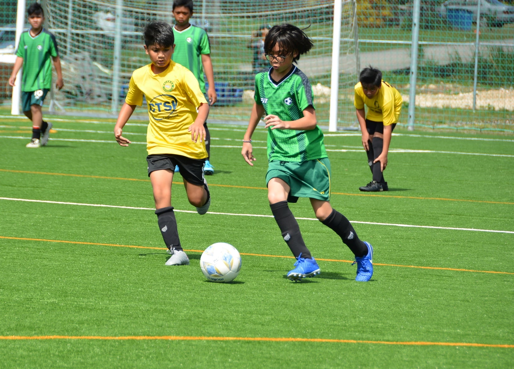 Matansa’s Dominic Chhetri and TanHoldings’ Julio Monserrat battle for the possession during a U13 boys division game of the TakeCare Youth Soccer League on Saturday at the NMI Soccer Training Center.