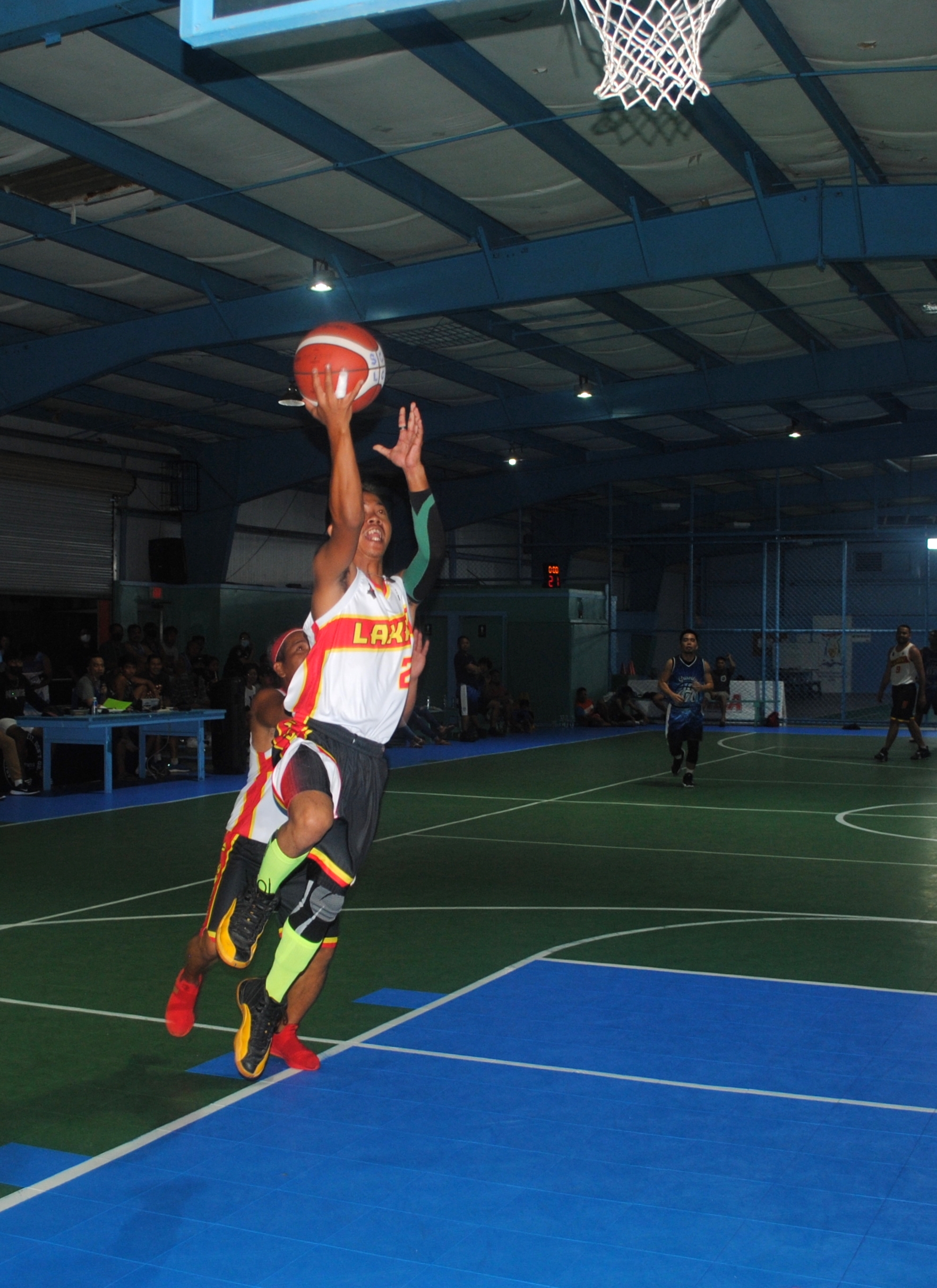 Lakay's Toribio extends for the open layup during an Open Division game of the Saipan Centennial Lions Club Basketball League at the TSL Sports Complex on Saturday.