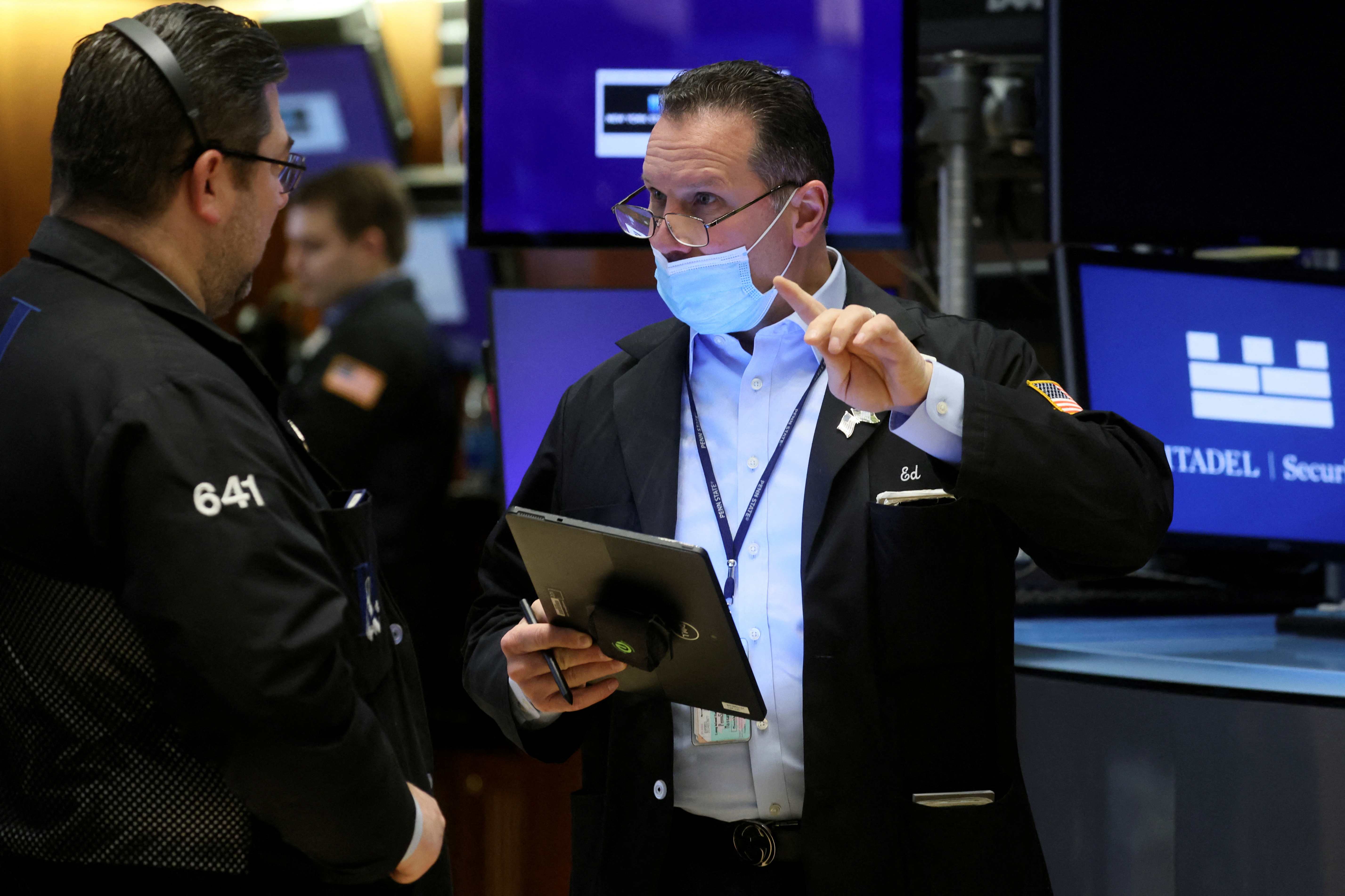 Traders work on the floor of the New York Stock Exchange in New York City, March 11, 2022.
