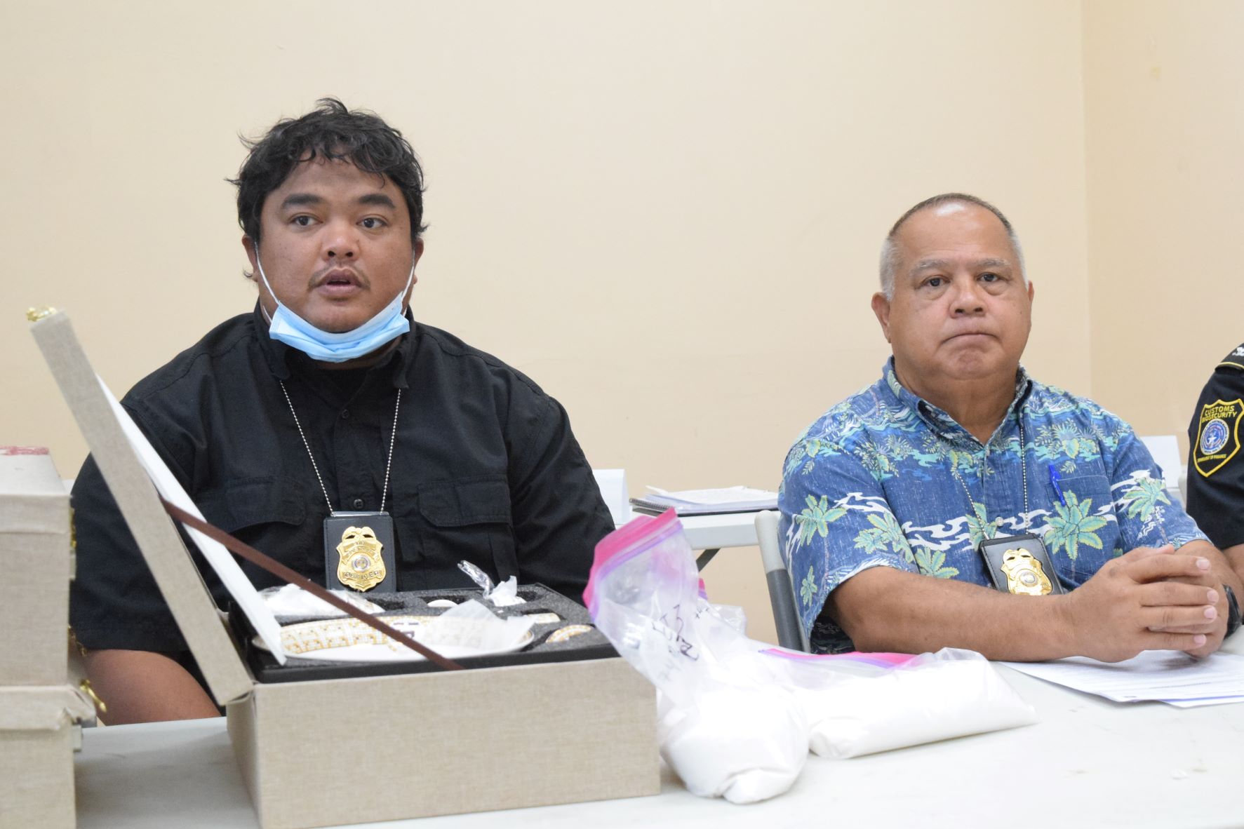 Division of Customs-Contraband Enforcement Bureau Capt. John Henry Sablan, left, and Customs Director Jose Mafnas present 4.9 pounds of crystal methamphetamine to the media during a press conference at the Customs office in Puerto Rico on Monday.