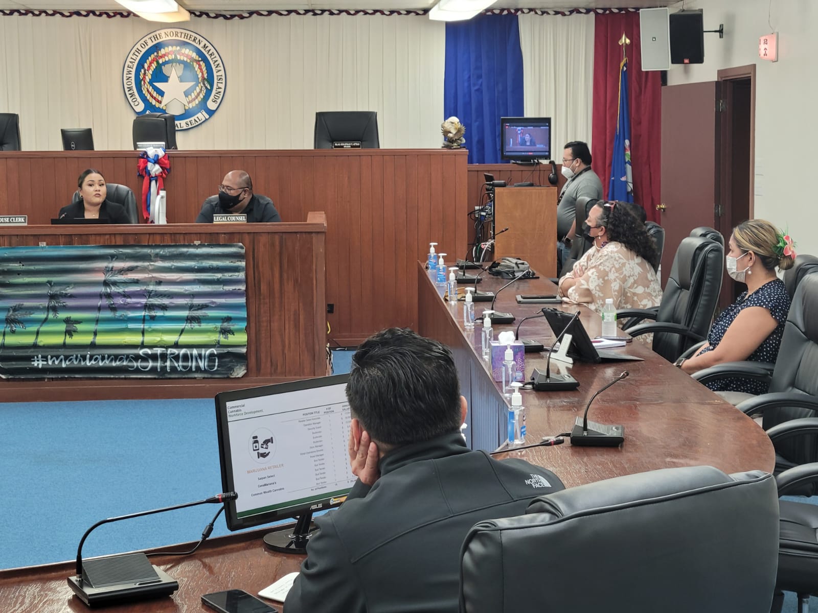 CNMI Cannabis Commission Managing Director Monique Sablan, left, speaks during a meeting with the House Committee on Cannabis in the House chamber on Tuesday. Also in photo are Reps. Leila Staffler and Corina Magofna, commission vice chairman Matt Deleon Guerrero, back to the camera, House legal counsel Joe Taijeron, and Legislative Bureau IT manager Jon Diaz. 