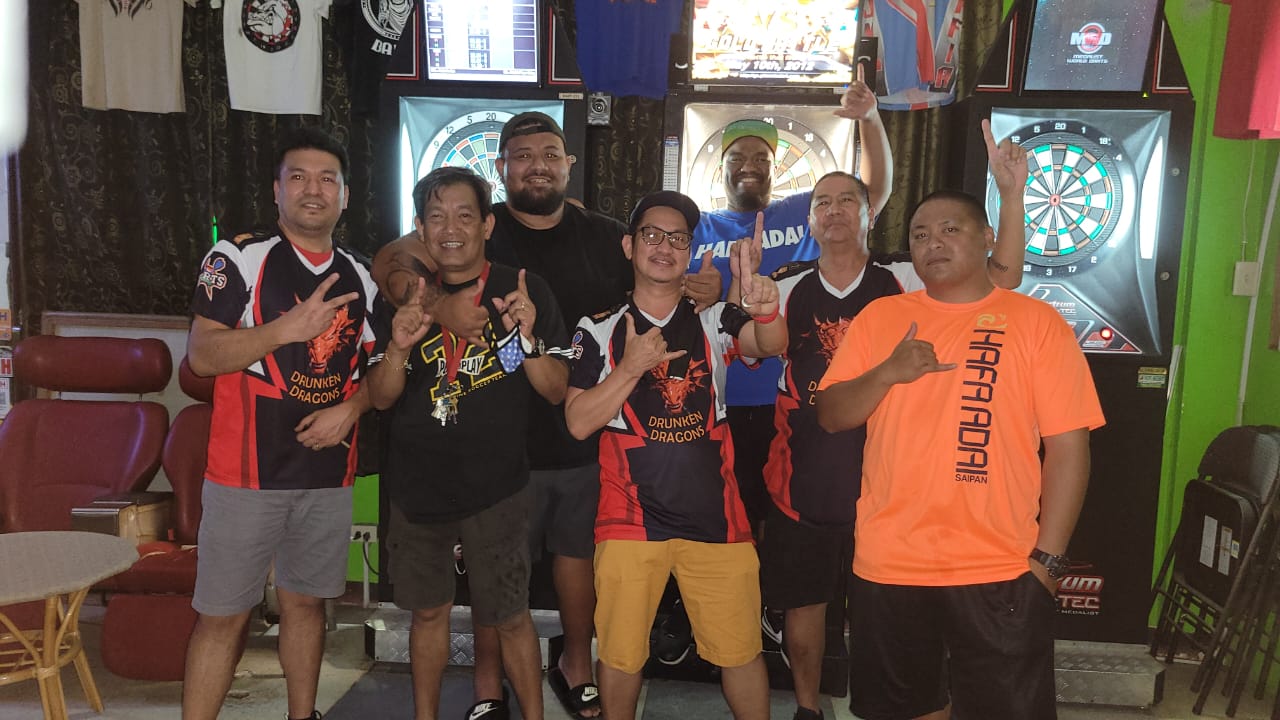 The 6JMS Drunken Dragons pose for a photo after winning their second consecutive Bud Light Cup  in the A Division of the SEDA League at the 6JMS Sports Bar on Monday.