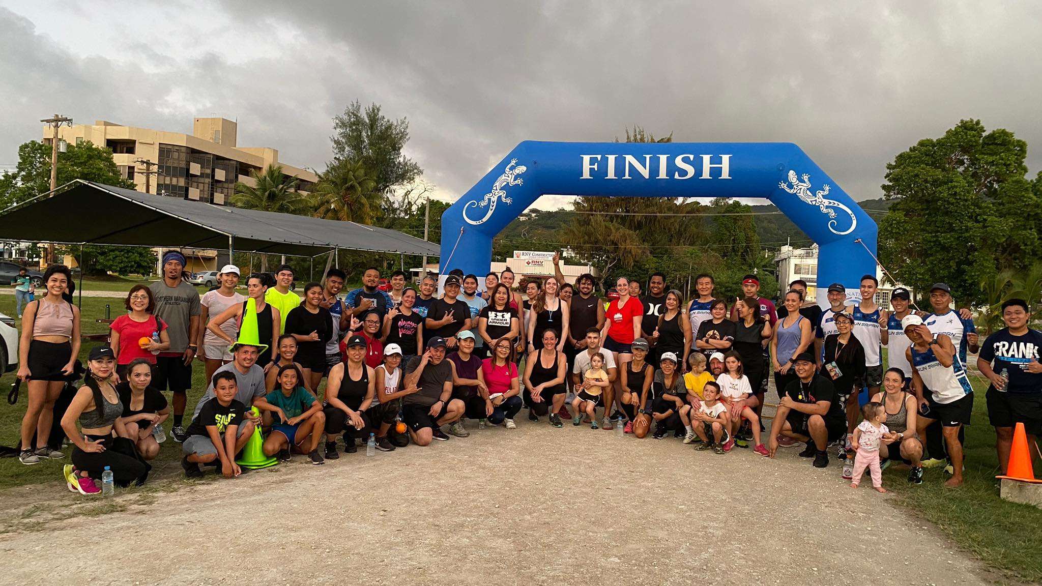 The participants pose for a photo before the start of the Run Saipan & CHCC Sunshine Squad's Happy Hearts 5K Fun Run at the Garapan Fishing Base on Friday.