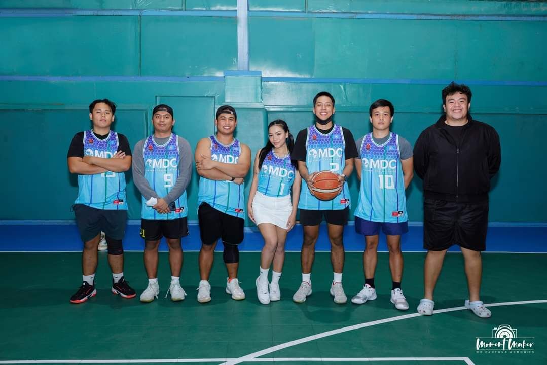 Team MDC and their muse pose for a photo during the opening ceremony of the Saipan Centennial Lions Club Basketball League on Feb. 22, 2022 at the TSL Sports Complex.