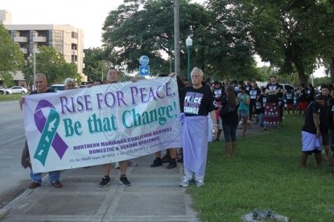 U.S. Congressman Gregorio Kilili Camacho Sablan, Rep. Edmund Villagomez, and Judge Kenneth Govendo lead the 2014 Men’s Walk Against Domestic Violence wearing skirts in solidarity with female victims and survivors. 