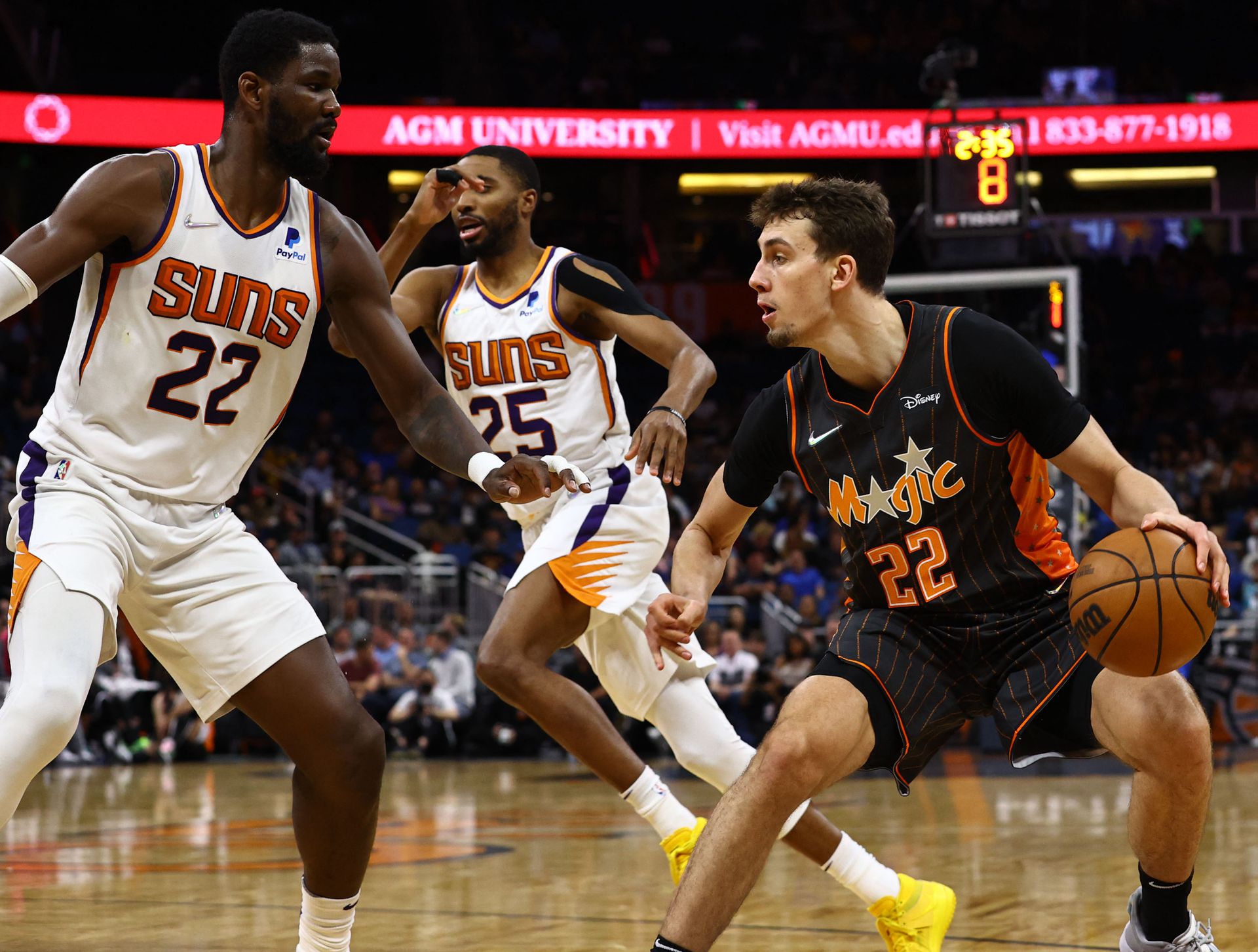 Orlando Magic forward Franz Wagner (22) moves to the basket as Phoenix Suns center Deandre Ayton (22) defends during the second quarter at Amway Center in Orlando, Florida on March 8, 2022.
