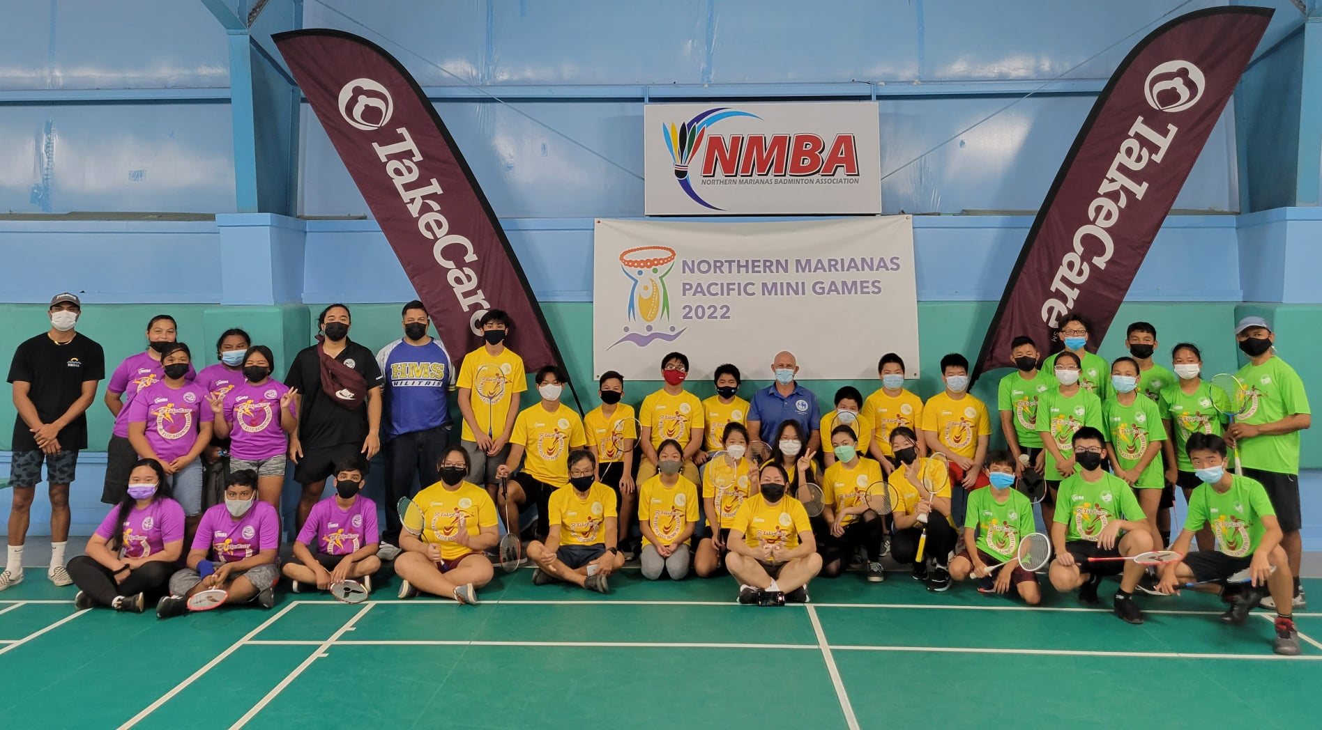 The players of the TakeCare Interscholastic Middle School Badminton League pose before the start of the matches at the TSL Sports Complex.