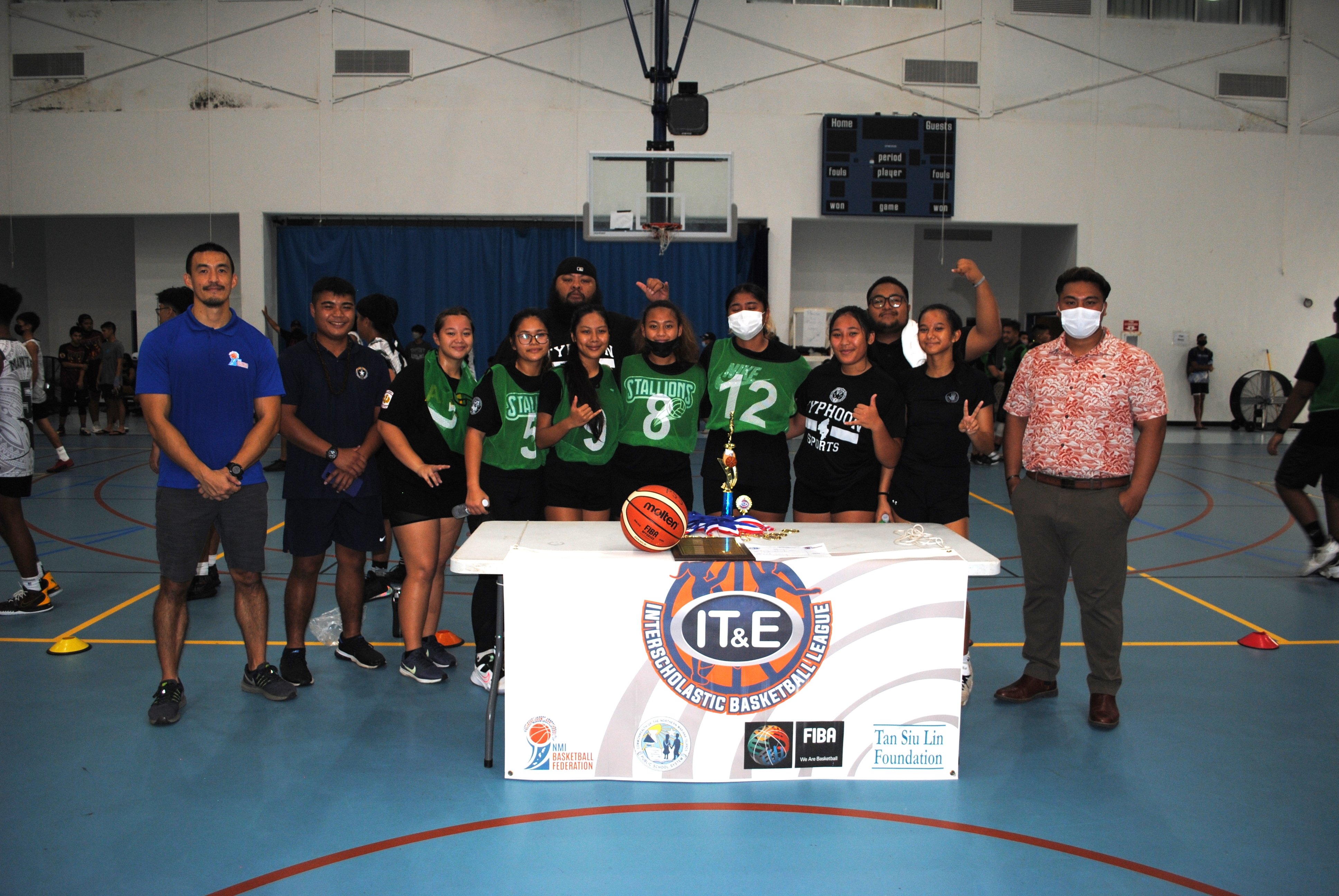 The Tinian Jr./Sr. High School Stallions pose with their second place trophy during the awards ceremony of the IT&E Interscholastic Basketball League on Saturday at the MHS gym.