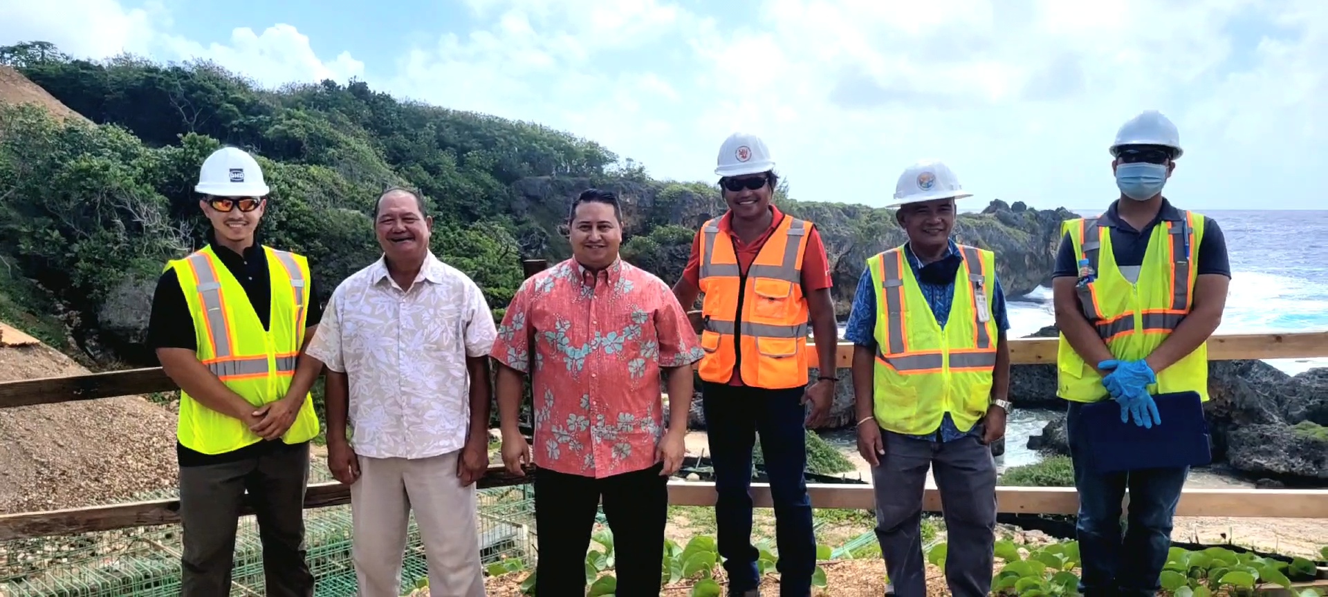 Gov. Ralph DLG Torres, third left, poses for a photo with DPW Secretary James Ada, second left, and representatives of RNV Construction and GHD Inc.