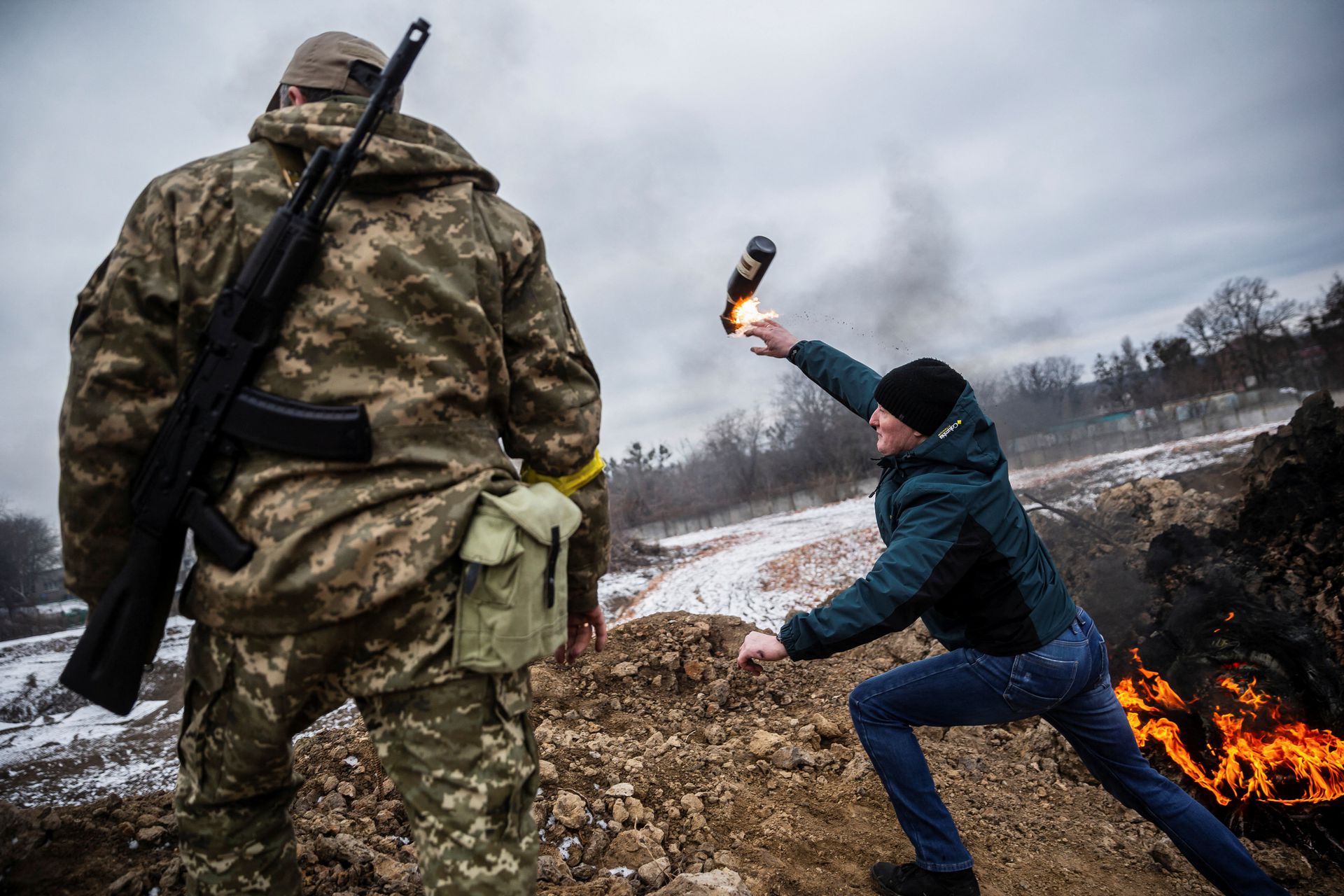 A civilian trains to throw Molotov cocktails to defend the city, as Russia's invasion of Ukraine continues, in Zhytomyr, Ukraine March 1, 2022.