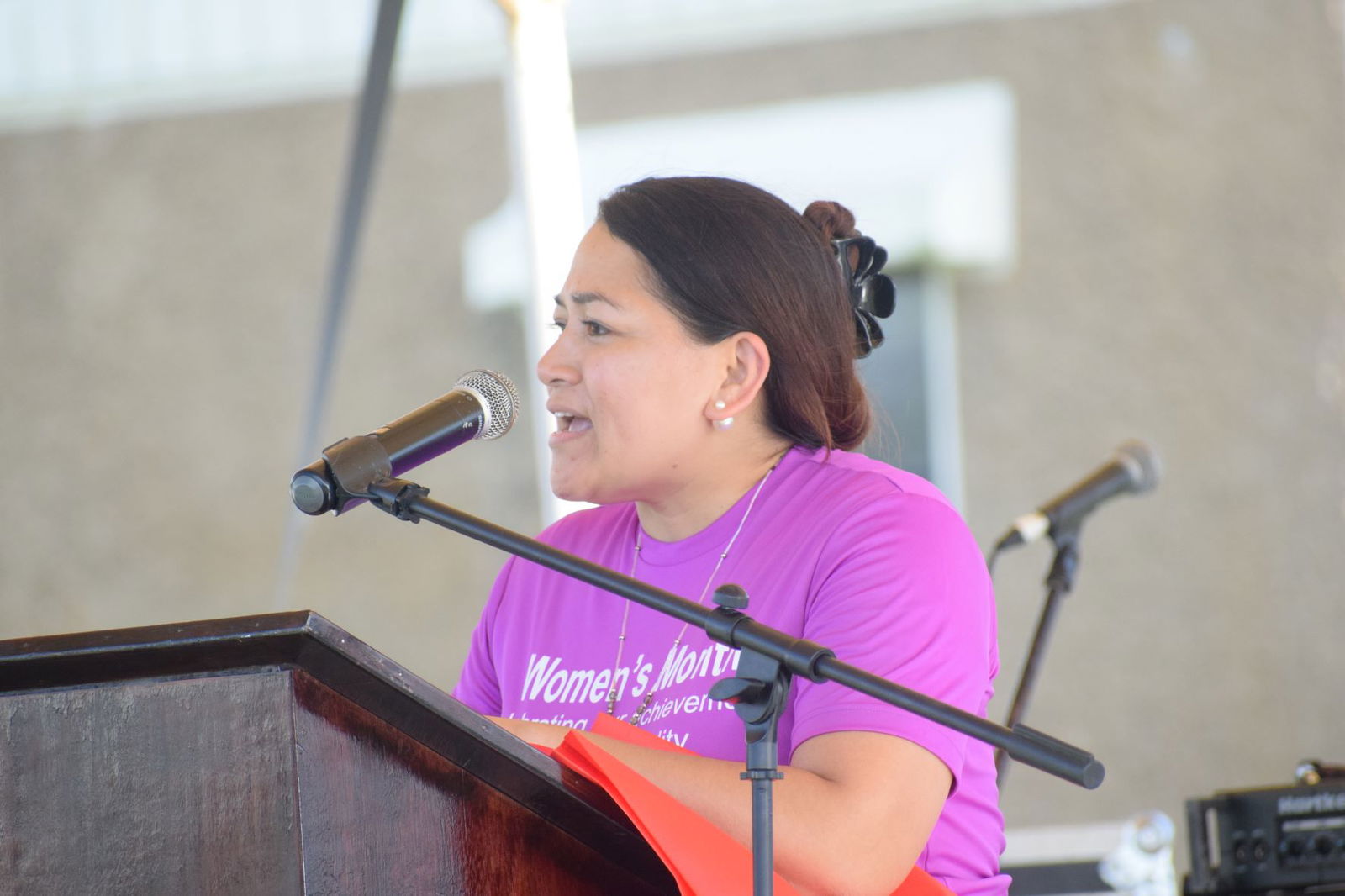 Women's Affairs Office Chairwoman Claudia Flores welcomes the participants of the Women Recognition & International Celebration event on the NMI Museum grounds Thursday.