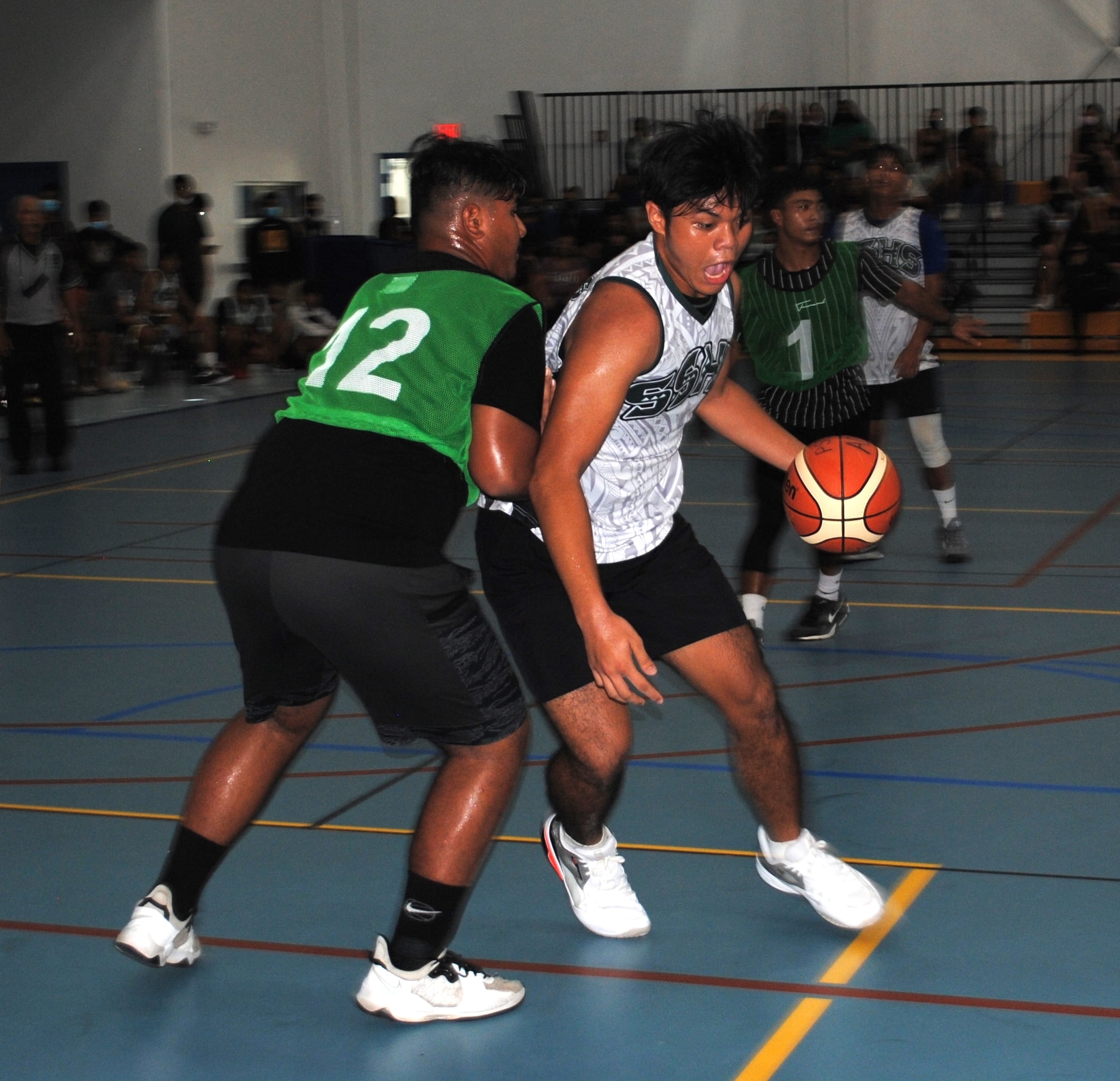Saipan Southern High School’s Emmanuel Feria backs down a defender in the post during  Saturday's championship game in the boys high school division of the IT&E Interscholastic Basketball League at the MHS gym.
