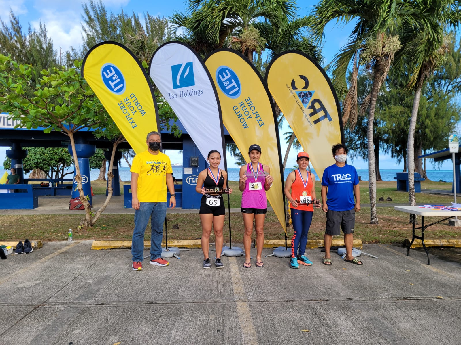 The winners of the women's 10km race pose with Triathlon Association of the CNMI officials. 