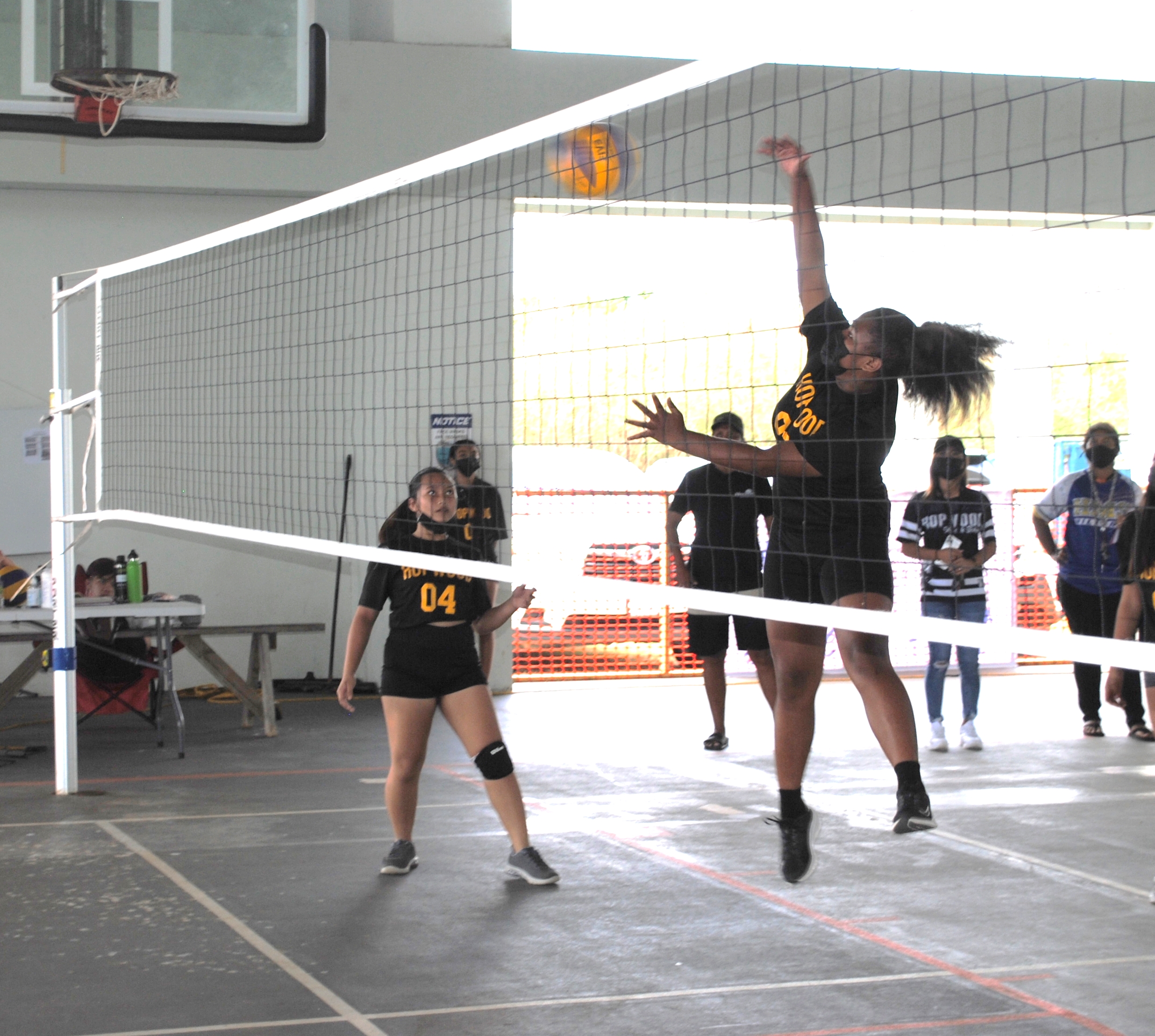 A Hopwood Middle School player connects the spike return.