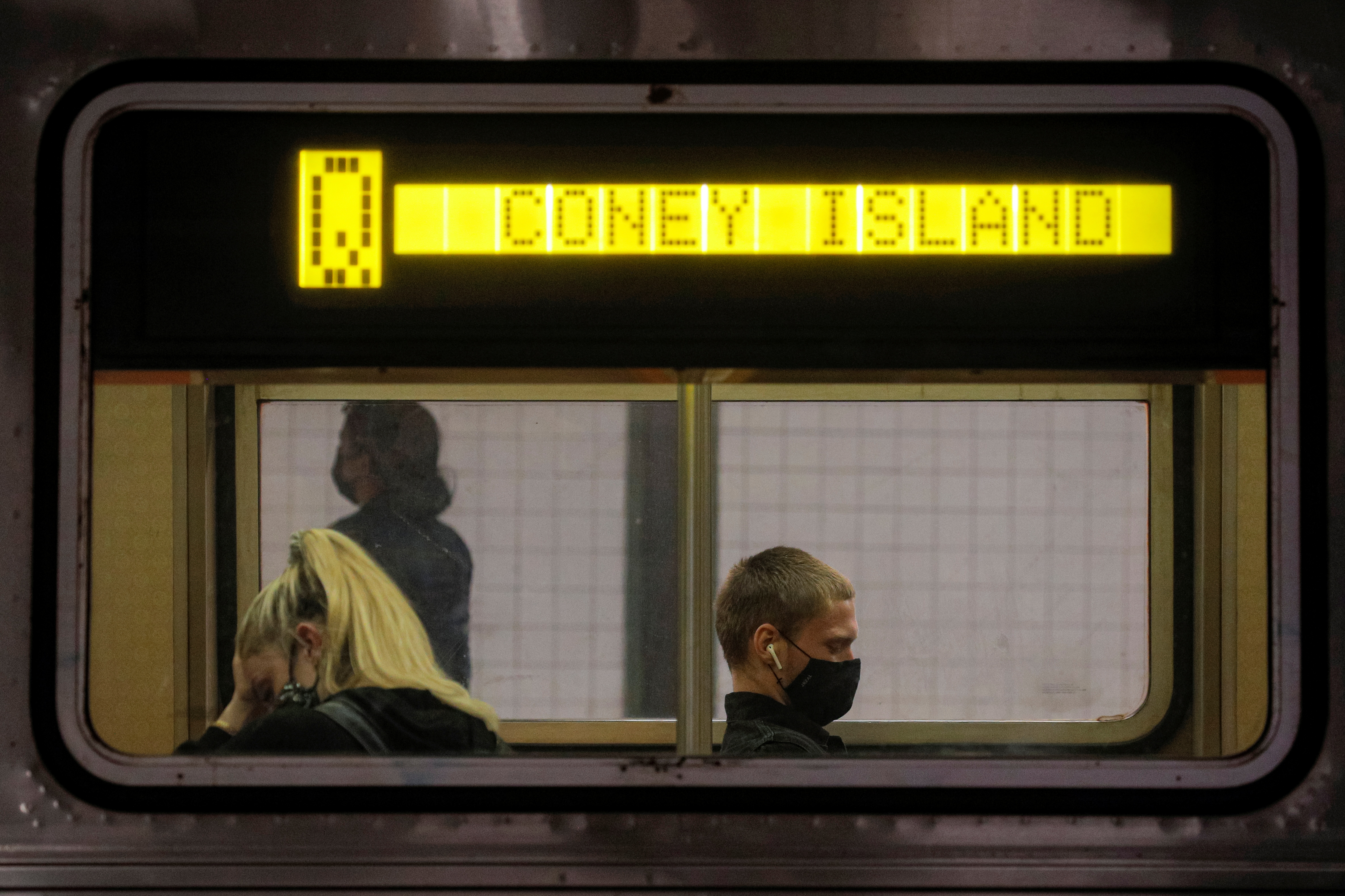 Passengers ride aboard the MTA's New York City Transit subway, in New York, May 3, 2021.