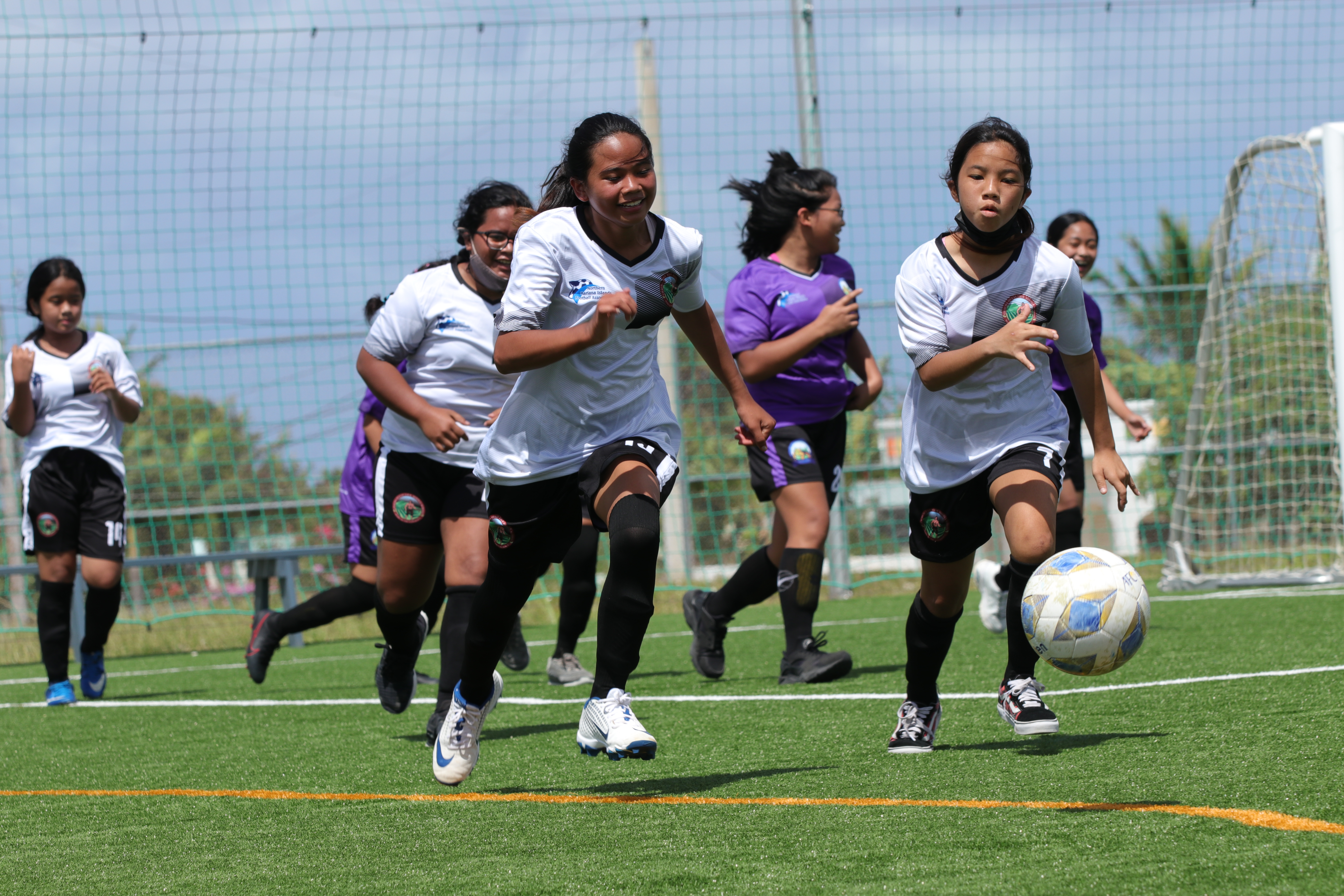 Hopwood Middle School players chase after the loose ball during a middle school division game of the NMIFA-PSS Interscholastic Soccer League Saturday at the NMI Soccer Training Center.