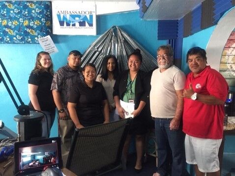Advocates and first responders pose for a photo with KKMP Radio Show hosts after a guest appearance during Sexual Assault Awareness Month 2017. 