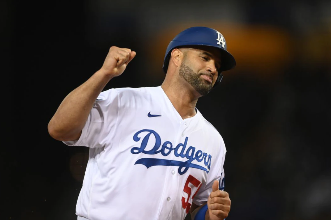 Los Angeles Dodgers first baseman Albert Pujols (55) celebrates as he runs home to score on a two run home run hit by left fielder Chris Taylor (3) in the fifth inning against the Atlanta Braves during game five of the 2021 NLCS at Dodger Stadium in Los Angeles, California on Oct, 21, 2021.