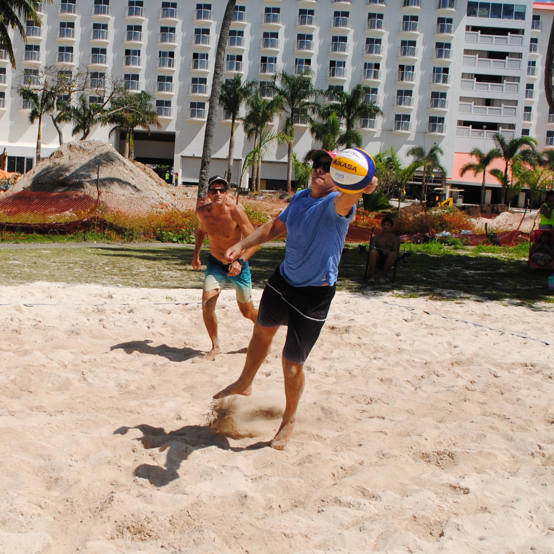 Lucky Leprechauns' Chris Nelson extends for the save as teammate Tyce Mister looks on during a For the Luck of Volleyball game on Saturday at the Crowne Plaza beach