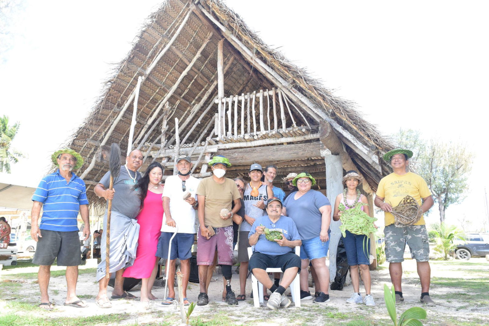 Matua Council for Native Chamorro Advancement Chairwoman Liana Hofschneider, third right, and Indigenous Affairs Office program manager Cris Ogo, center, join  indigenous artists and educators at Guma Higay during "Silebrasion Mes Chamorro" on Saturday at Civic Center in Susupe.