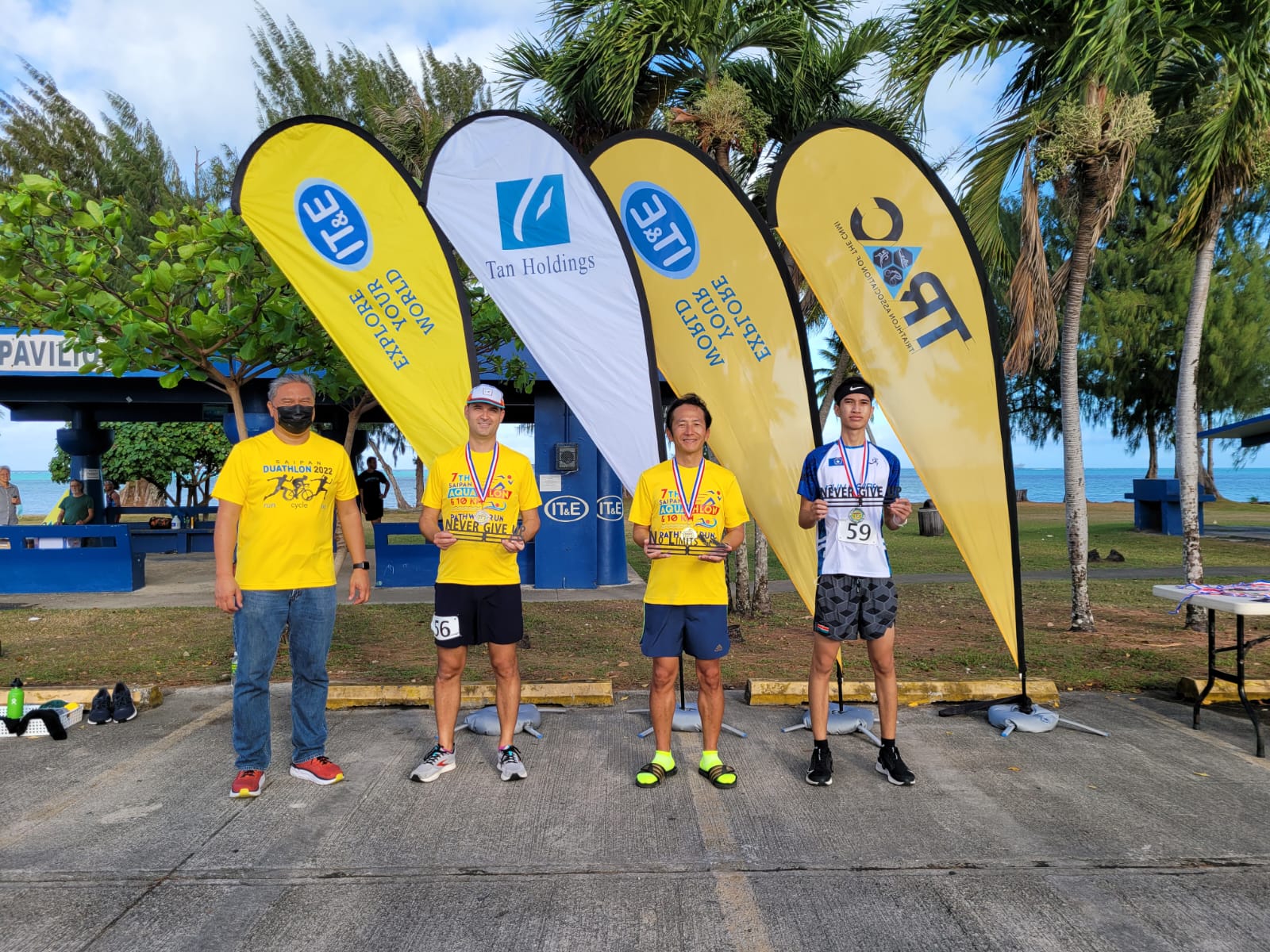 The winners of the men's 10km race pose for a photo with Triathlon Association of the CNMI officials.  