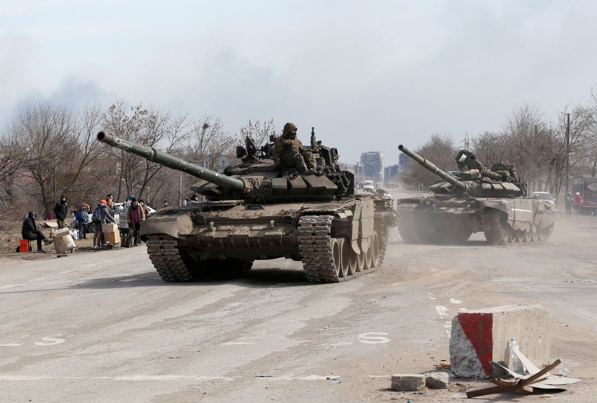 Service members of pro-Russian troops are seen atop of tanks  on the outskirts of the besieged southern port city of Mariupol, Ukraine on March 20, 2022.