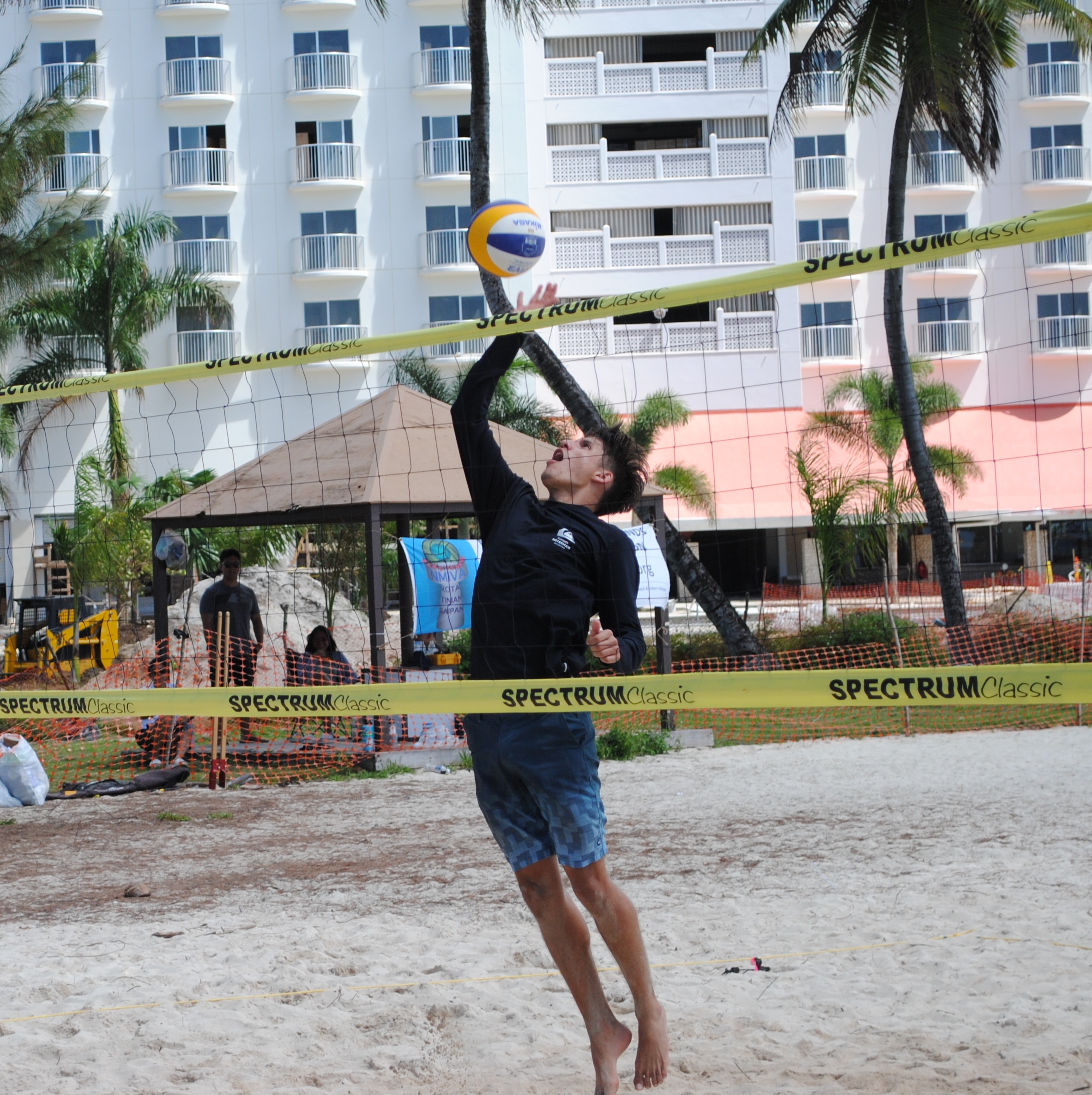 Matthew Berline leaps for the tip over the net.
