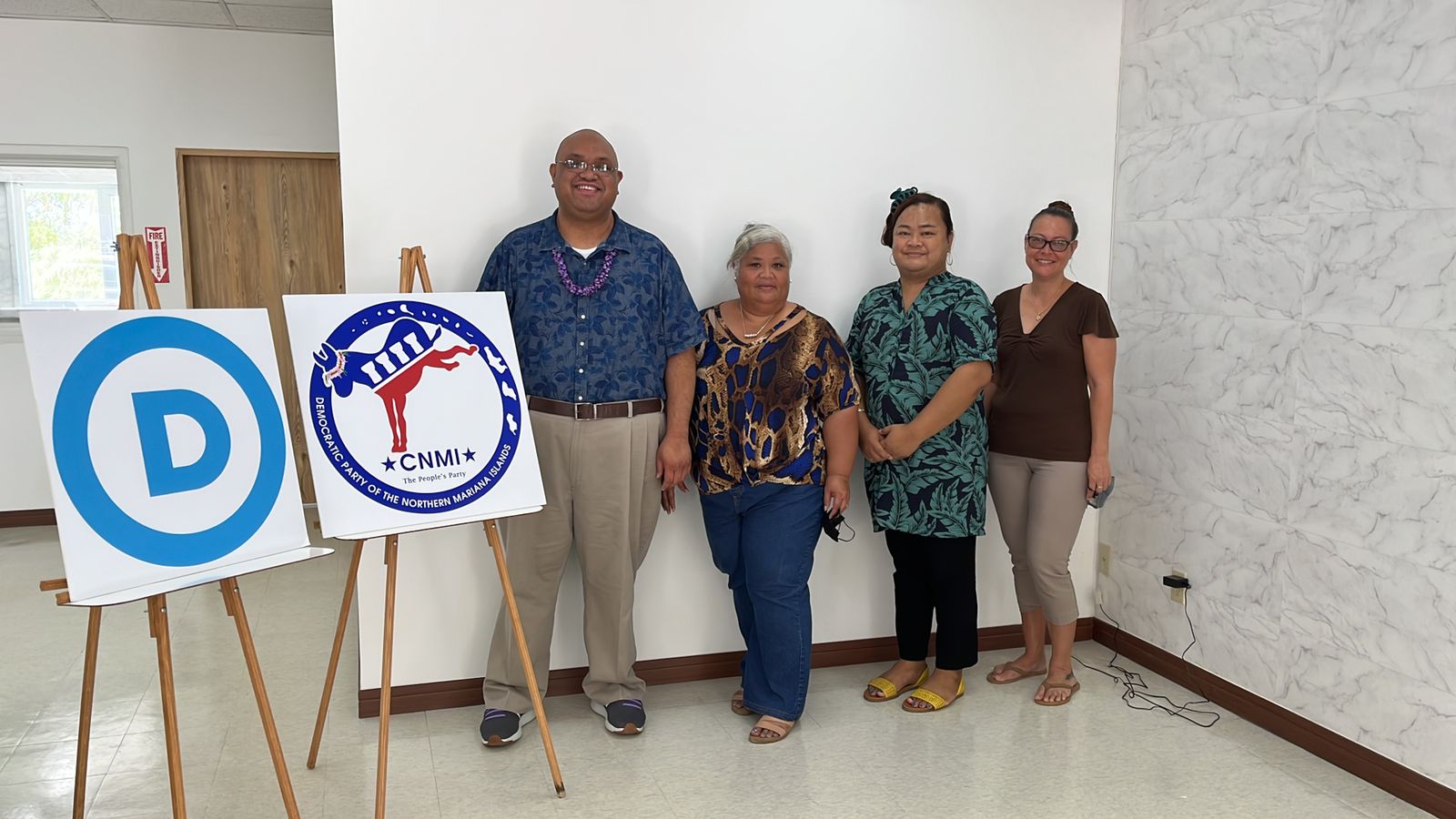 The NMI Democratic Party's newly elected interim Chairman Jonathan Cabrera with Vice Chair Luella Ichihara Marciano, Treasurer Shawna Indalecio and Secretary Melia K. Johnson pose for a photo after the meeting at the party headquarters in Chalan Laulau Monday night.