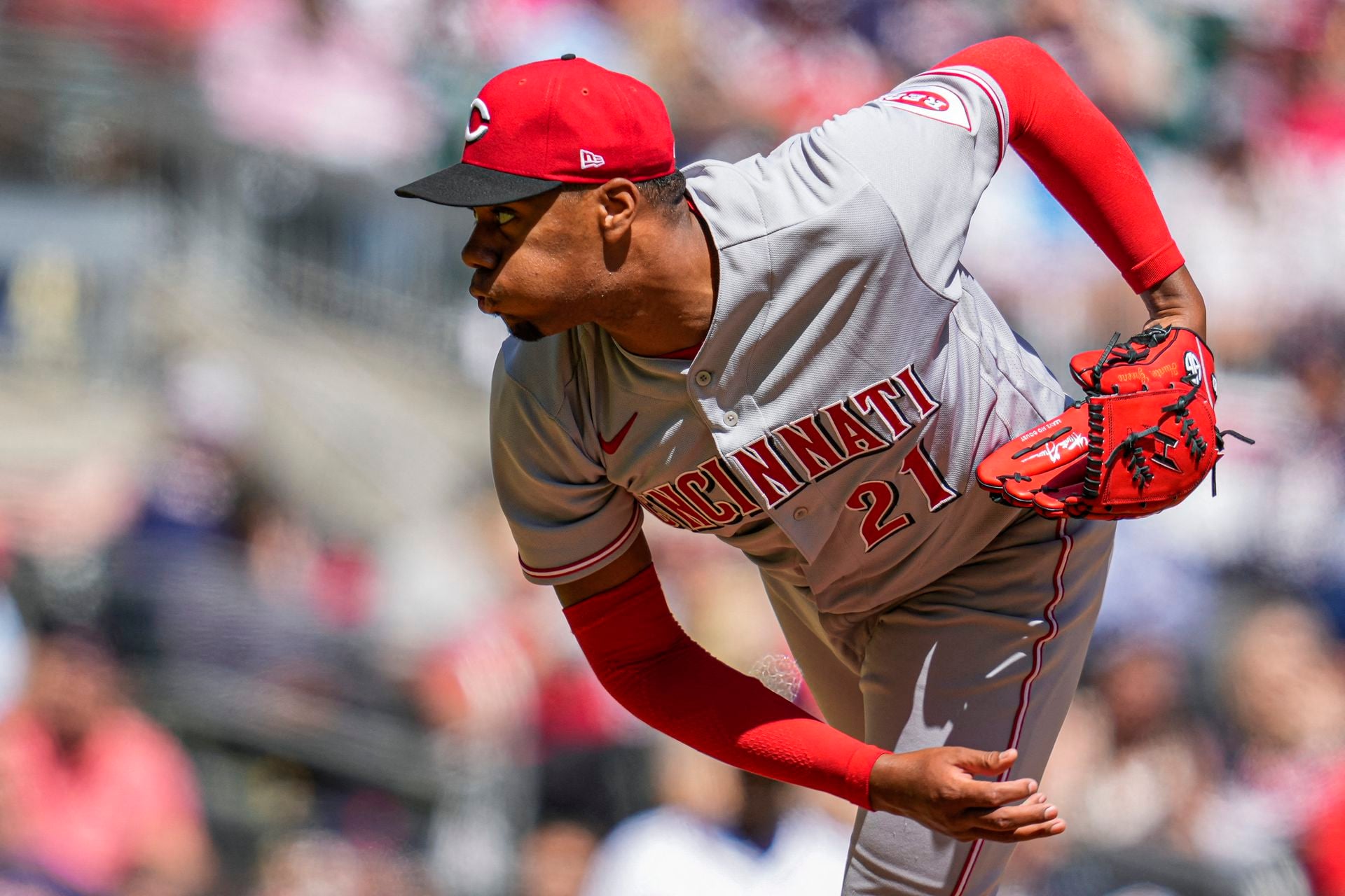 Cincinnati Reds starting pitcher Hunter Greene (21) pitches against the Atlanta Braves during the fourth inning at Truist Park in Cumberland, Georgia on April 10, 2022.