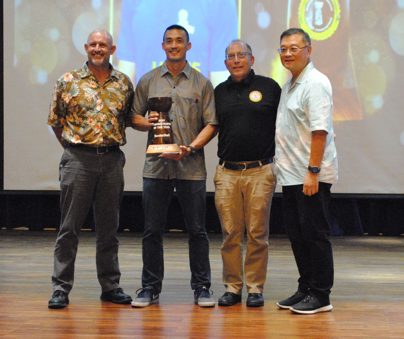 James Lee, second left, is this year’s Administrator of the Year. Also in photo are Northern Marianas Sports Association President Jerry Tan, right, and board members Nick Gross left, and John Hirsh, 2nd right.