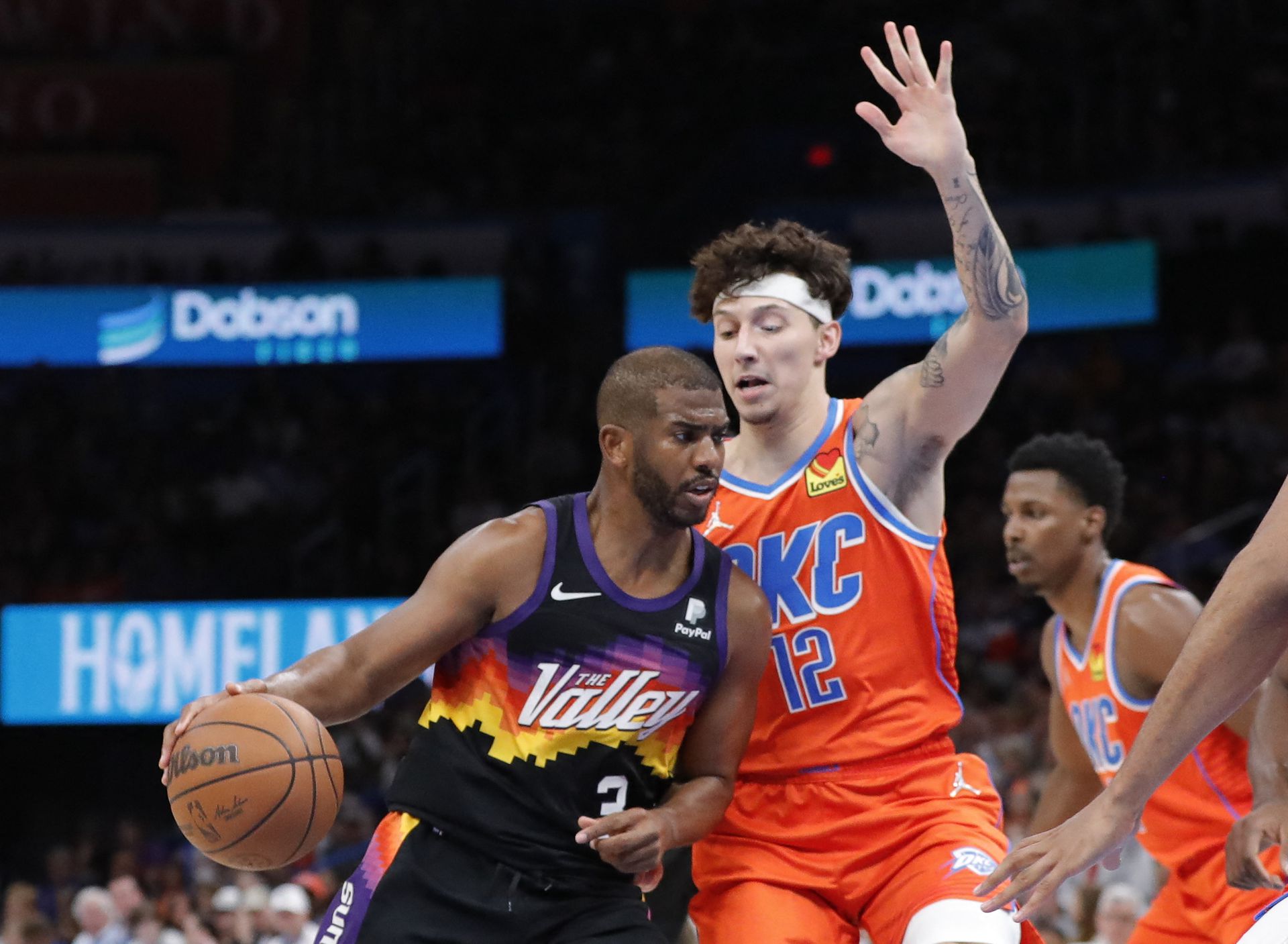 Phoenix Suns guard Chris Paul (3) is defended by Oklahoma City Thunder forward Lindy Waters III (12) on a play during the second half at Paycom Center in Oklahoma City, Oklahoma on April 3, 2022.