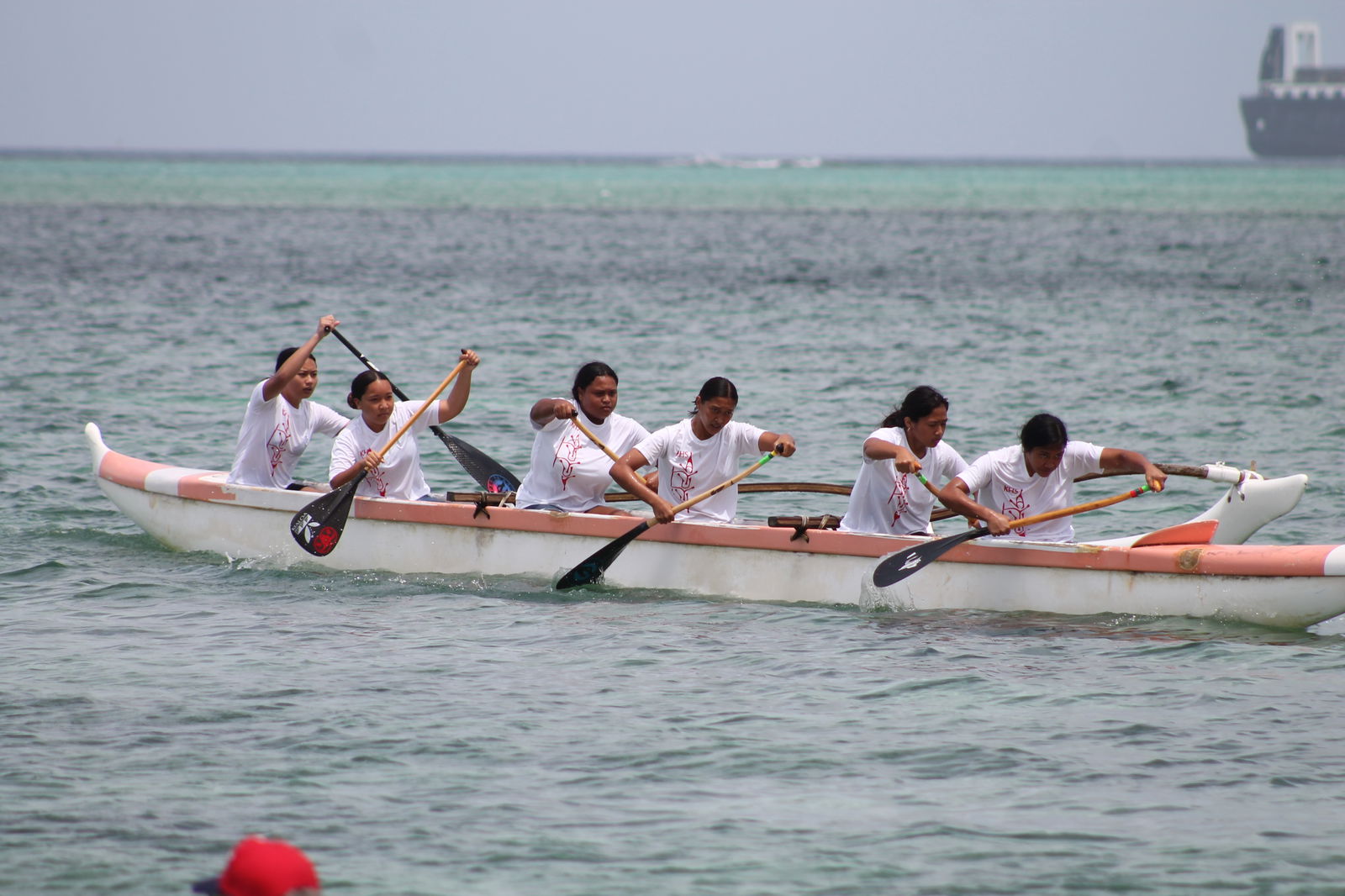 The girls of Kagman High School push for the first place finish in the 1000m distance of the PSS Interscholastic Outrigger Race Series Saturday at Kilili Beach.