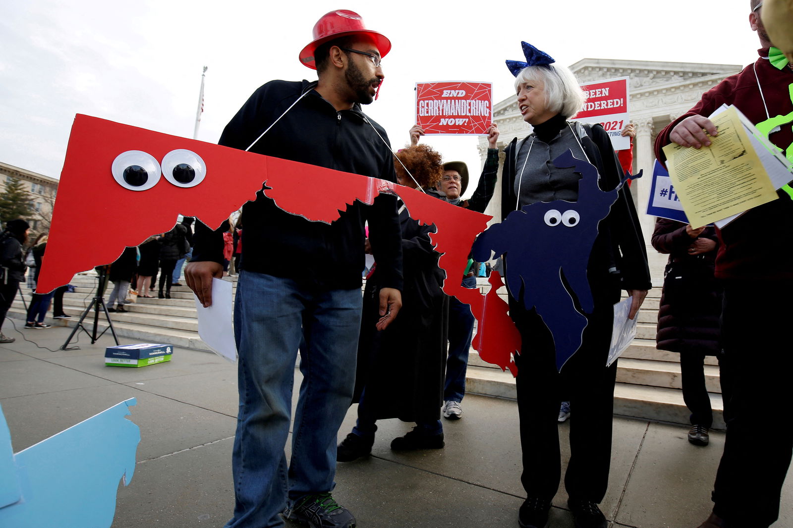 Demonstrators rally with cut-outs of congressional districts in front of the Supreme Court in Washington, D.C., March 28, 2018, before oral arguments on Benisek v. Lamone, a redistricting case on whether Democratic lawmakers in Maryland unlawfully drew a congressional district in a way that would prevent a Republican candidate from winning.