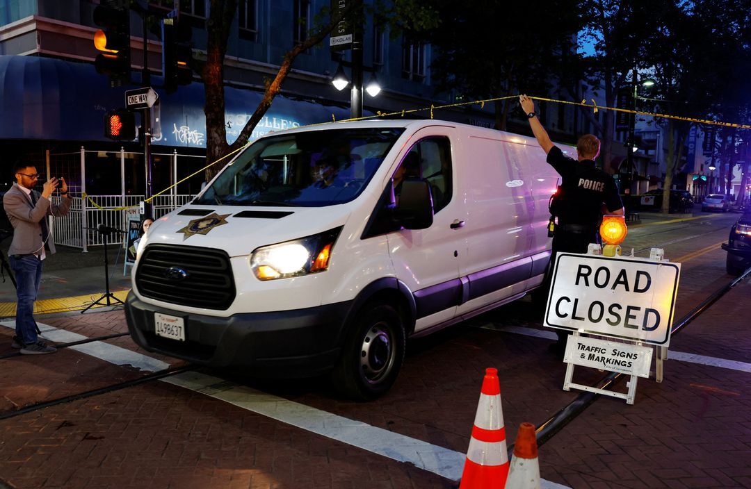 A coroner's van leaves the scene of an early-morning shooting in a stretch of downtown near the Golden 1 Center arena in Sacramento, California on April 3, 2022.