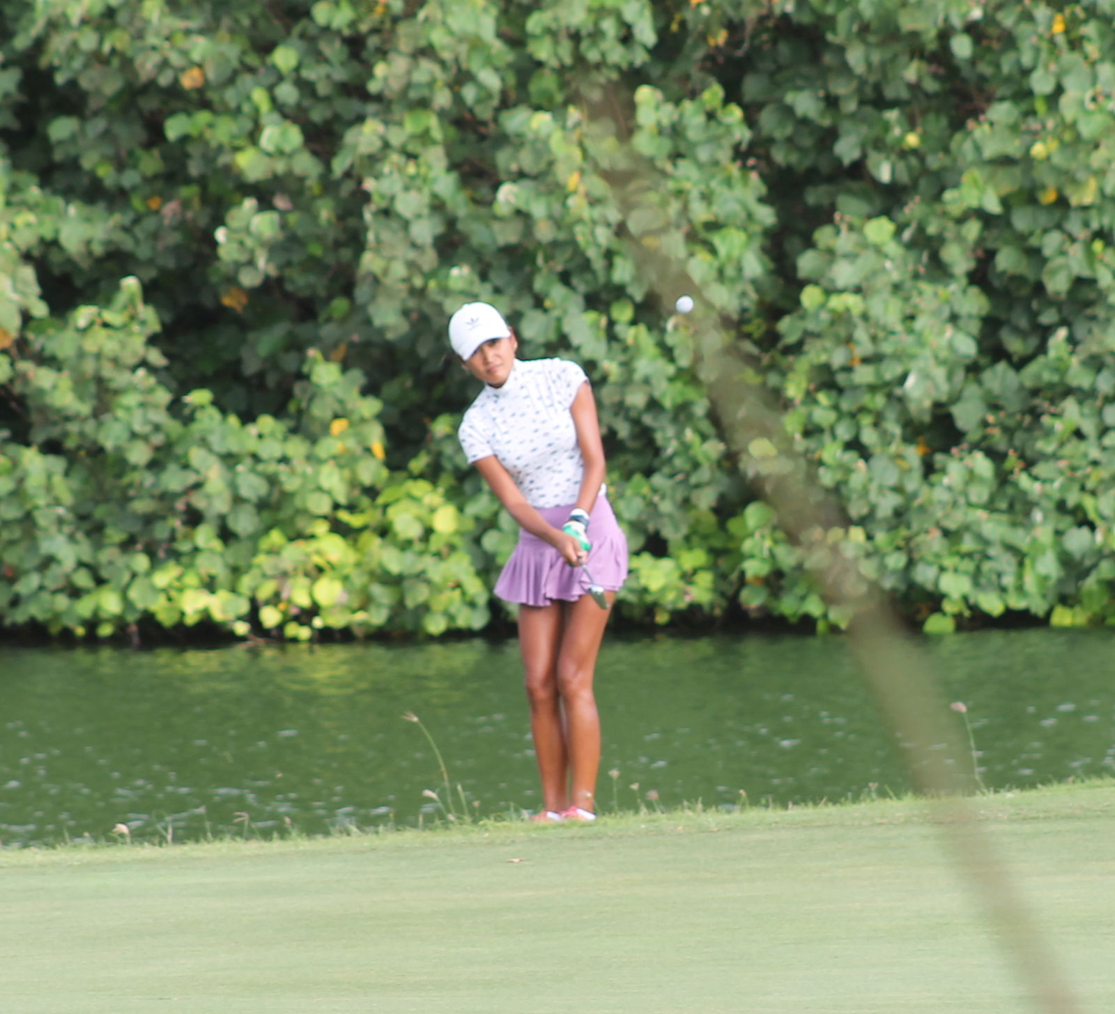 Rose Rohringer looks on after chipping into the green.