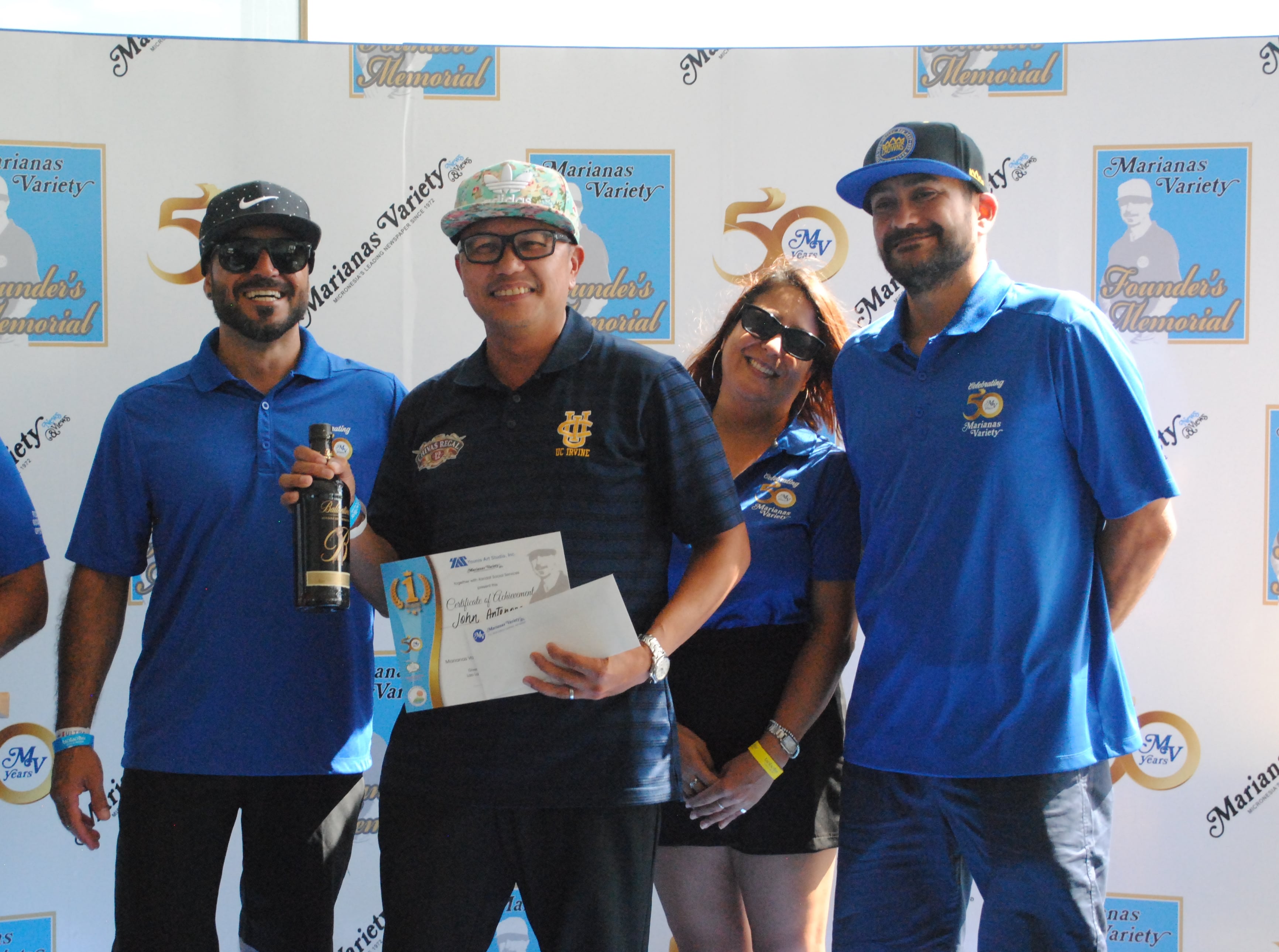 John Antenorcruz, 2nd left, poses with Marianas Variety President Amier Younis, left, and siblings Farah Younis, 2nd right, and Salam Younis during the awards ceremony of the MV Founder's Memorial Golf Tournament at Laolao Bay Golf & Resort on Saturday.