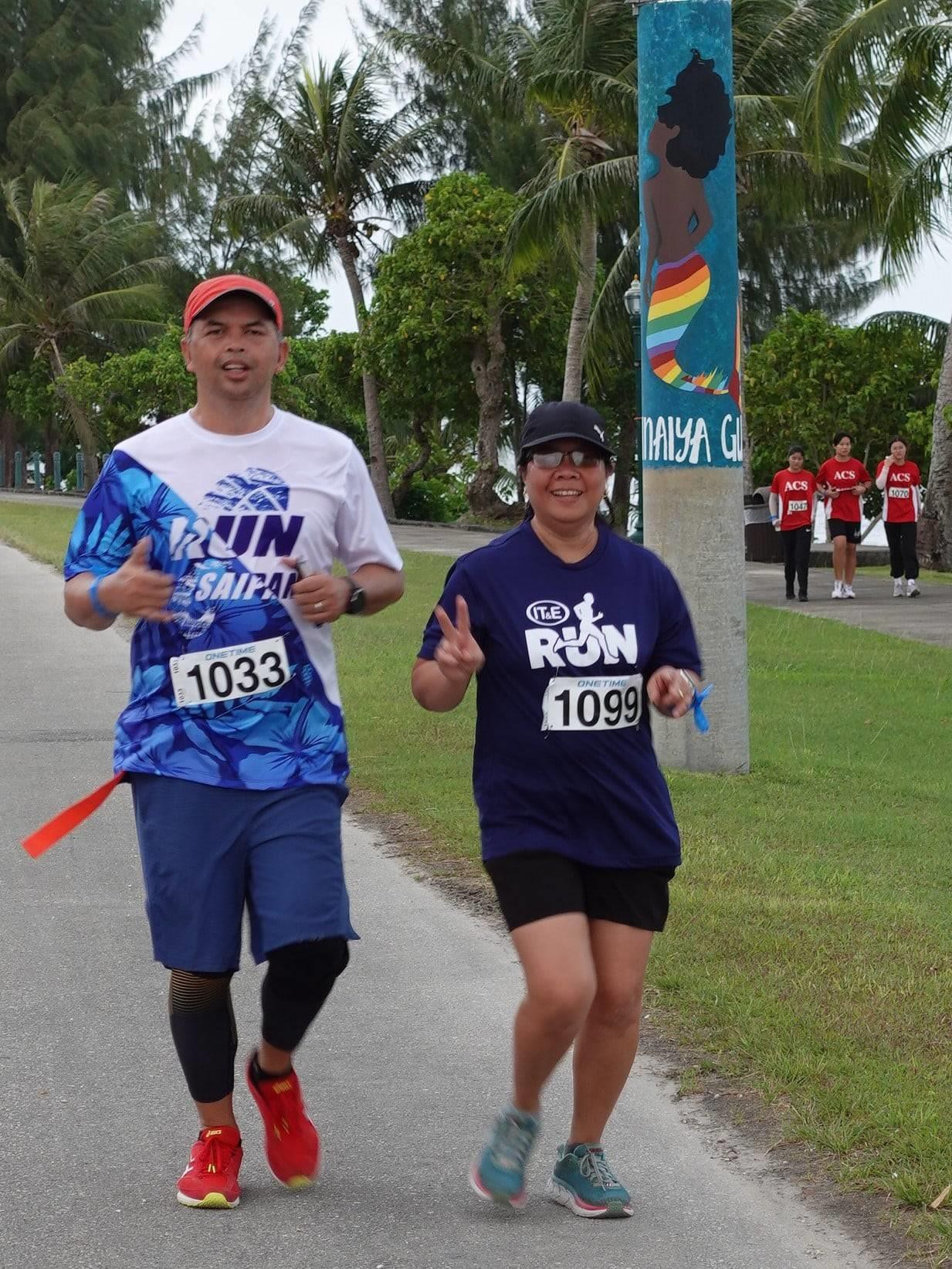 Husband and wife team Eric and Sharon Abragan enjoy the 10K course in the Saipan Marathon on April 9, 2022.