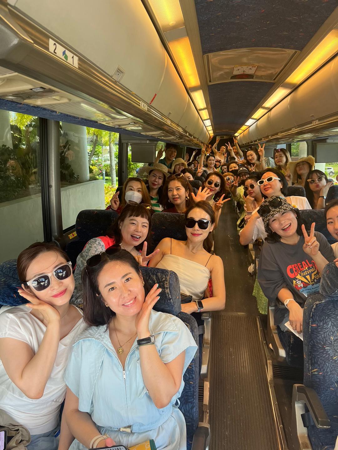 Part of a group of over 100 representatives of Riman Cosmetics from South Korea prepare for an island tour of Saipan.