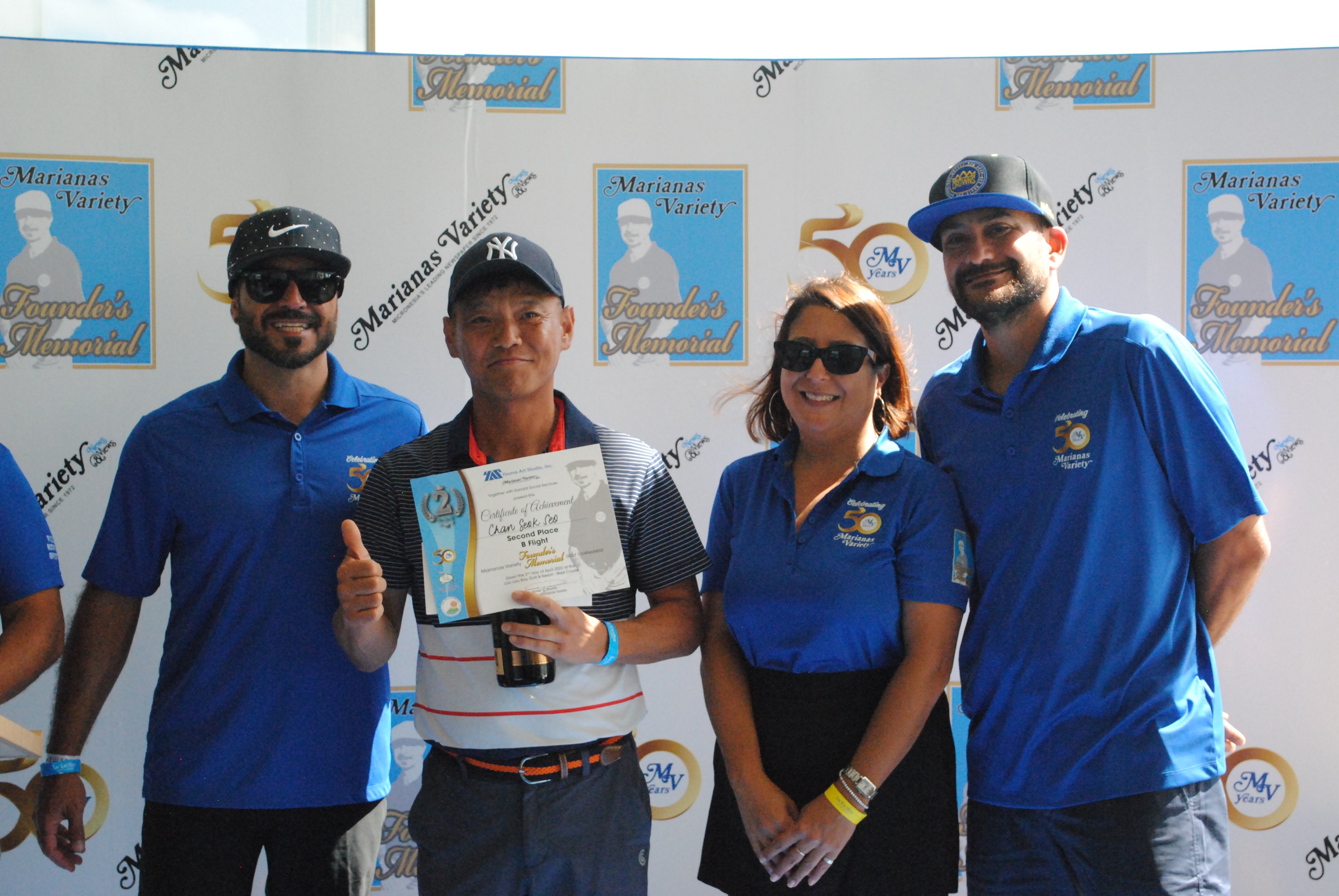 Chan Seok Seo, 2nd left, poses with Marianas Variety President Amier Younis, left, and siblings Farah Younis, 2nd right, and Salam Younis during the awards ceremony of the MV Founder's Memorial Golf Tournament at Laolao Bay Golf & Resort on Saturday.