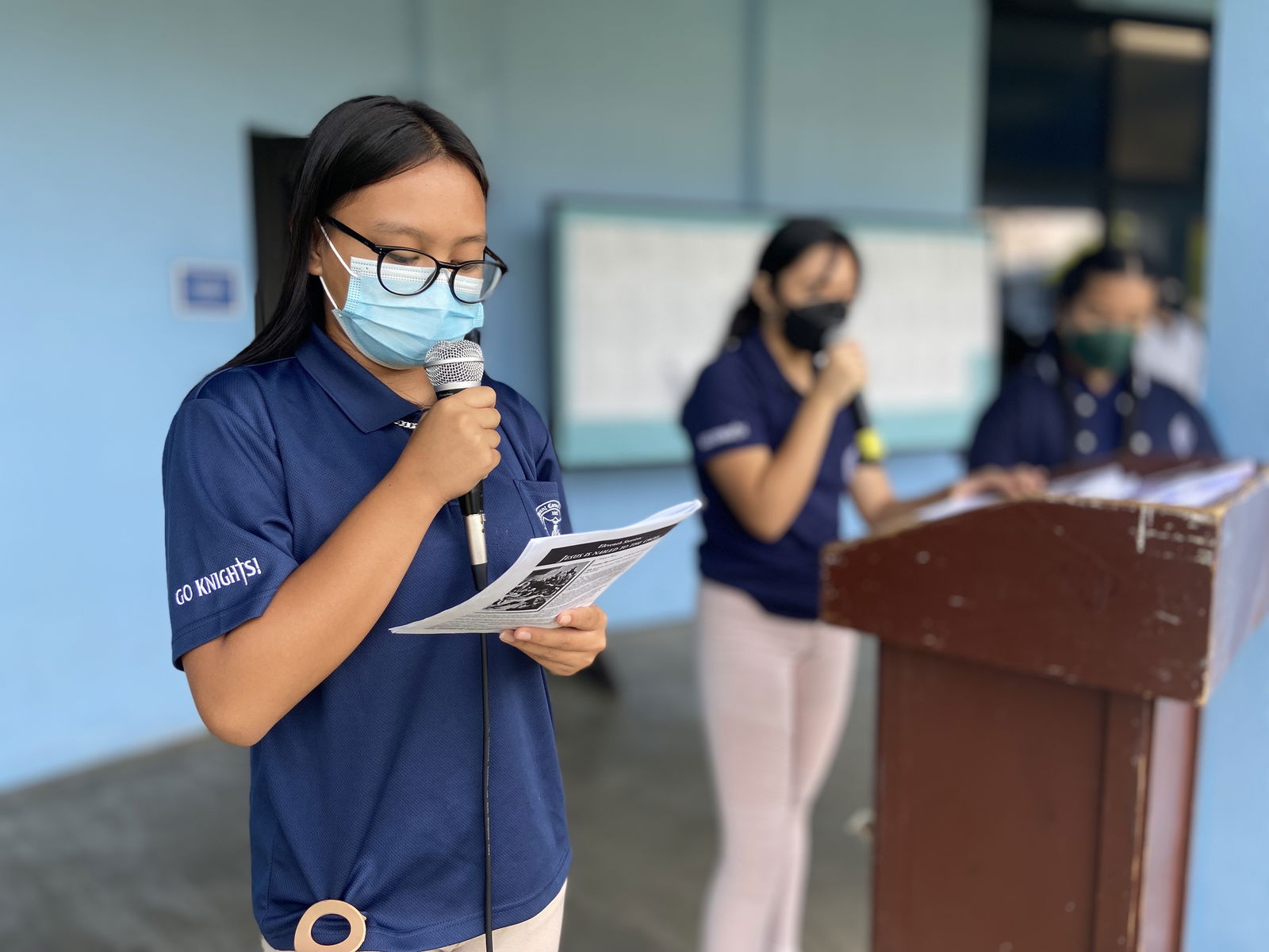 Mount Carmel School’s tenth-grade student Tyana Kisha Tenorio Tesiro reads “The Twelfth Station — Jesus Dies on the Cross” during the Stations of the Cross.