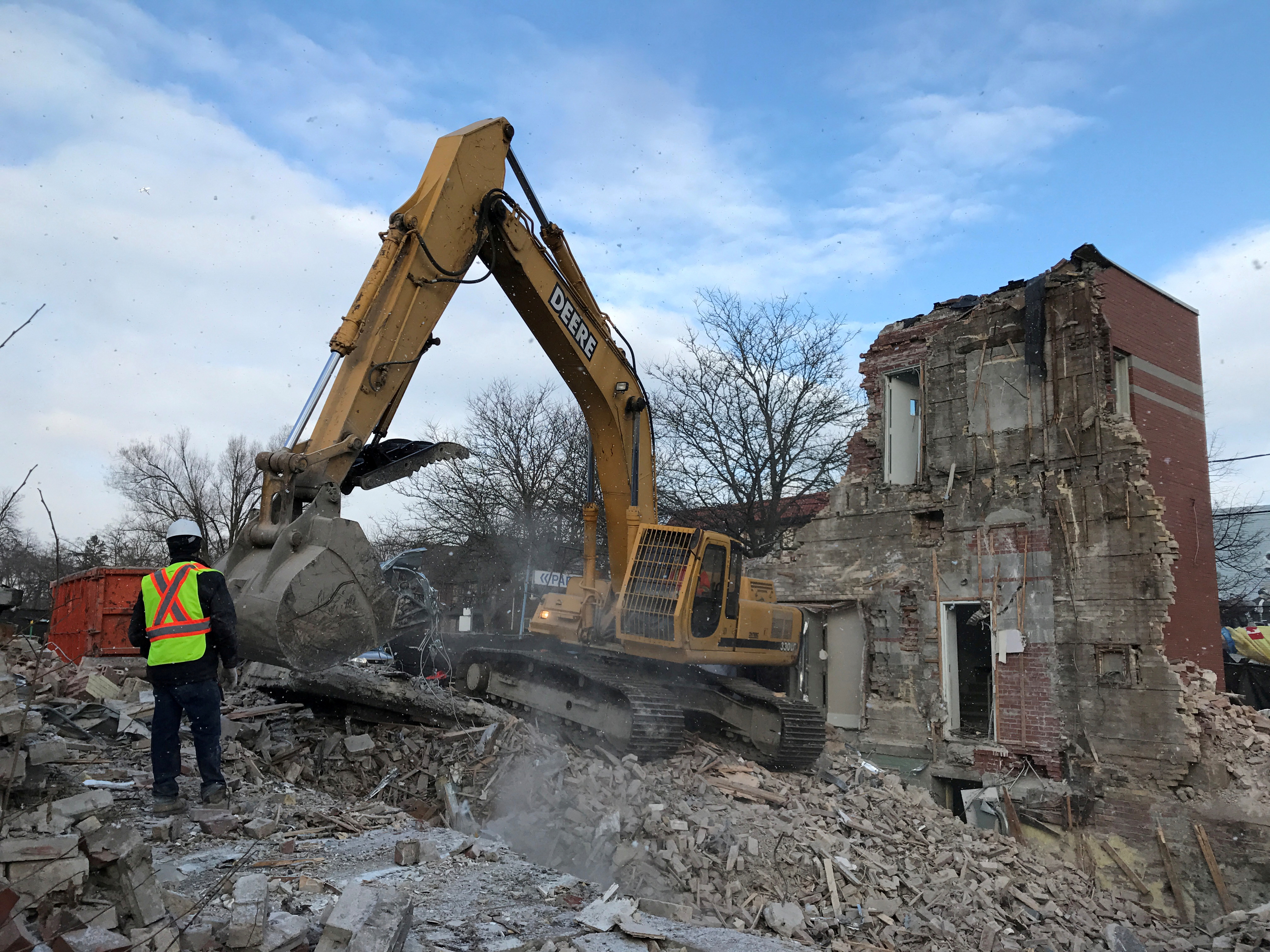 Construction equipment digs through the remains of a 110-year-old Bank of Montreal building  in Toronto, Ontario, Canada on January 27, 2017.