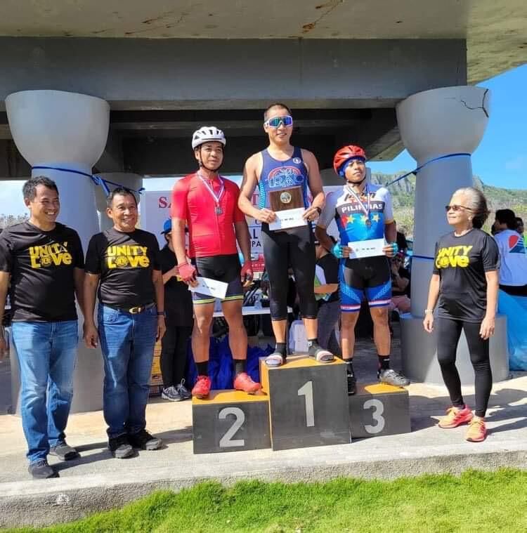 Nap Dizon, center, poses with Rolando Gacayan, left, and Mike Hokage, right, along with Saipan Unity Lions Club members during the award ceremony of the Saipan Unity Lions Club 6th Annual Bike Race Sunday at Banzai Cliff.