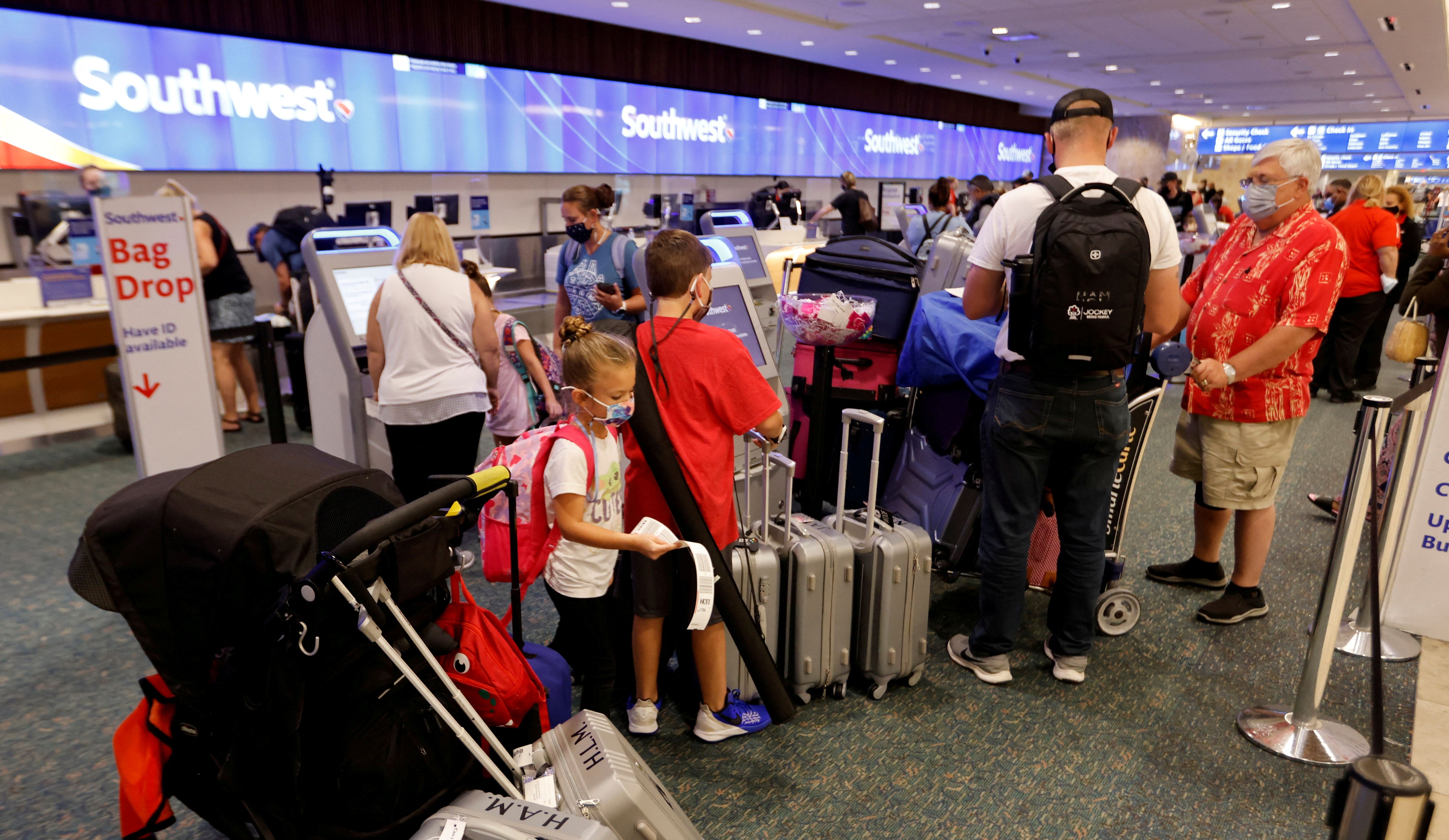 Passengers check in for a Southwest Airlines flight at Orlando International Airport in Orlando, Florida on Oct. 11, 2021.