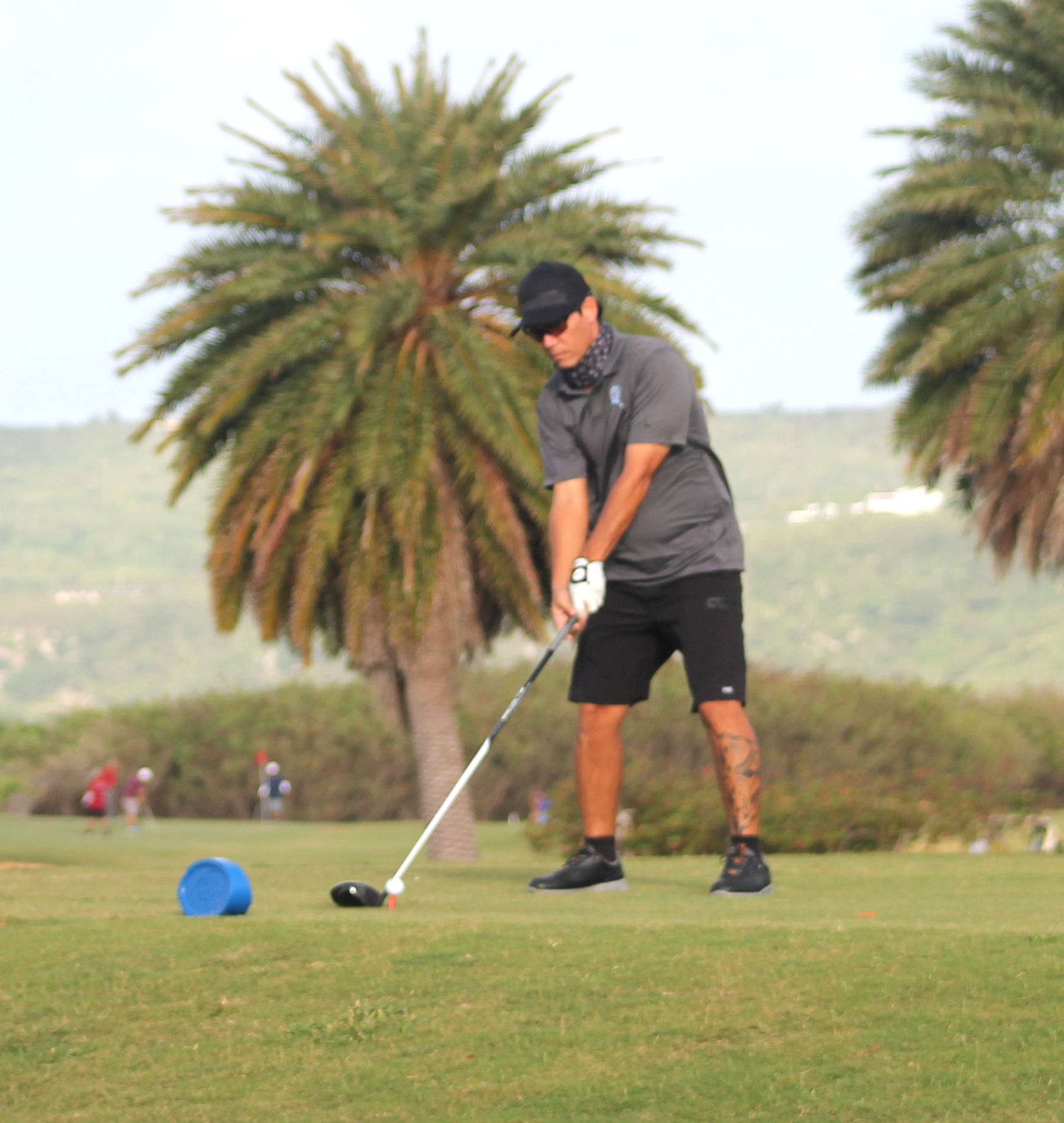 Peter “Dung” Tenorio sets up for the tee off during the Marianas Variety Founder's Memorial Golf Tournament at Laolao Bay Golf & Resort on Saturday.