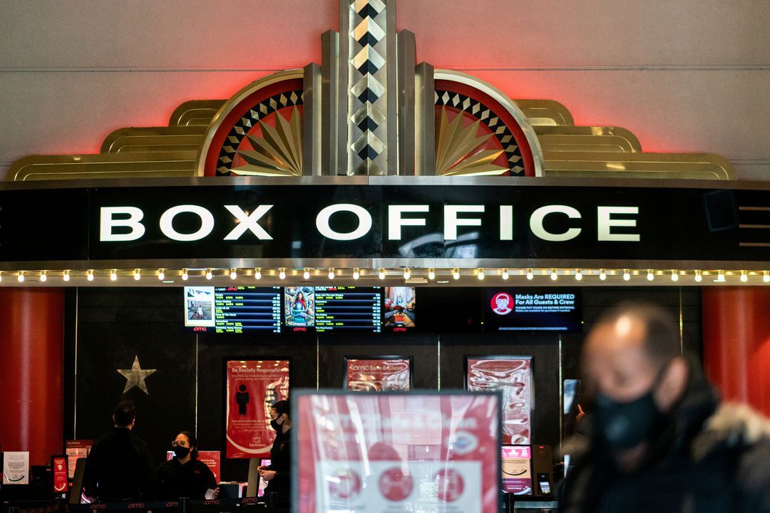A guest purchases a ticket in front of a box office at AMC movie theatre in Lincoln Square in the Manhattan borough of New York City on March 6, 2021.