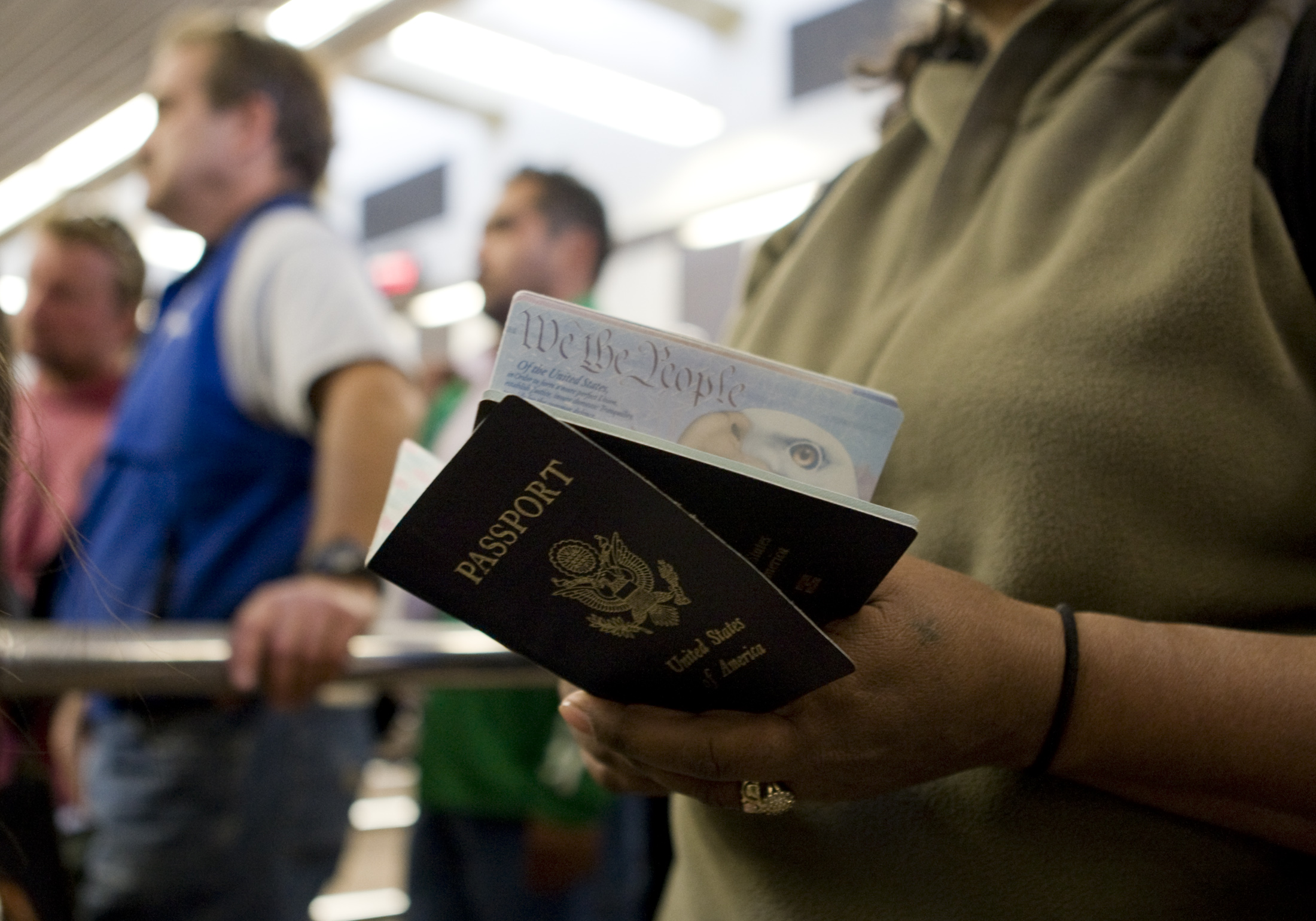 A woman holds passports while waiting to cross at the San Ysidro border crossing in San Ysidro, California on Jan. 31, 2008.
