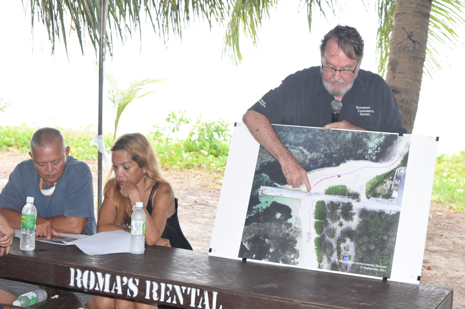 Micronesian Environmental Services project manager John Gourley presents an  image depicting the Sugar Dock reconstruction project.
