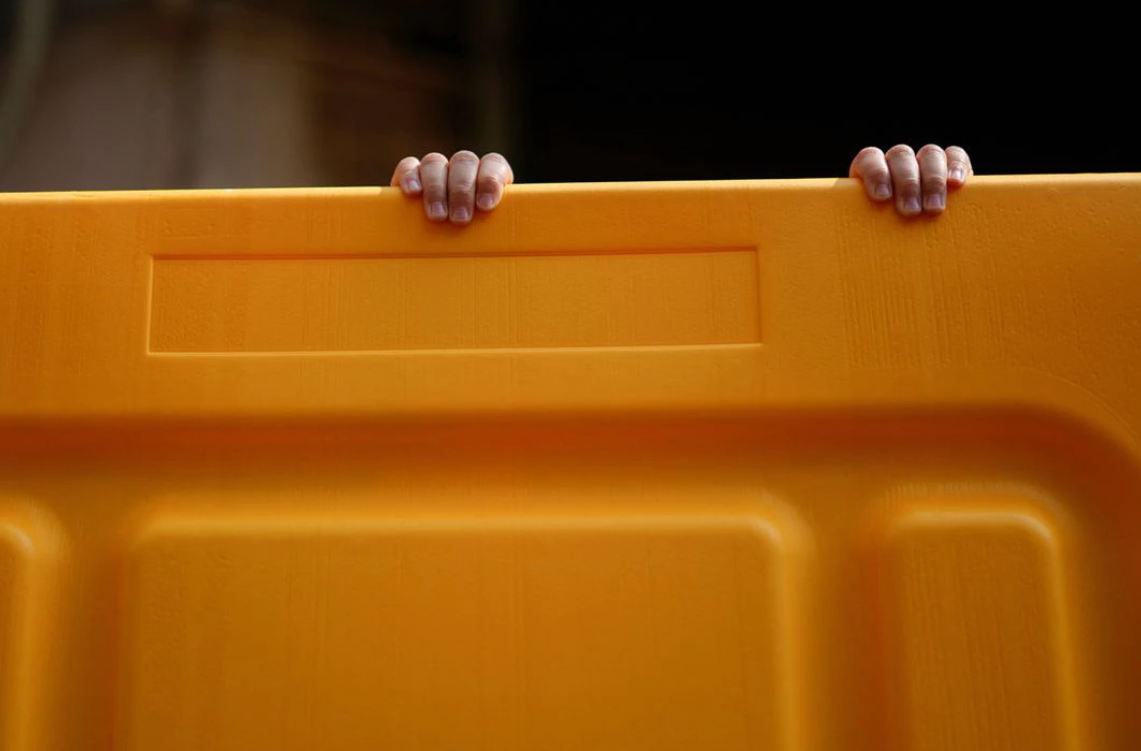 A child's hands are seen on a barrier at an area under lockdown amid the coronavirus disease pandemic, in Shanghai, China on March 26, 2022.