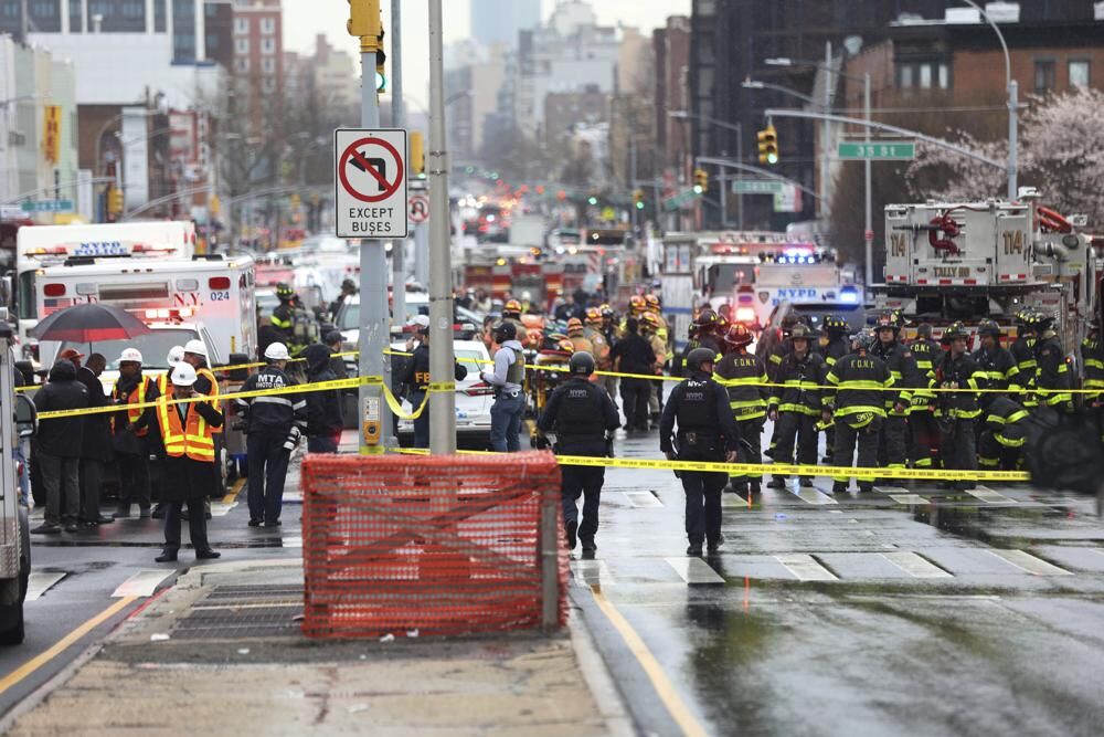 Law enforcement gather near the entrance to a subway stop in the Brooklyn borough of New York, Tuesday. 